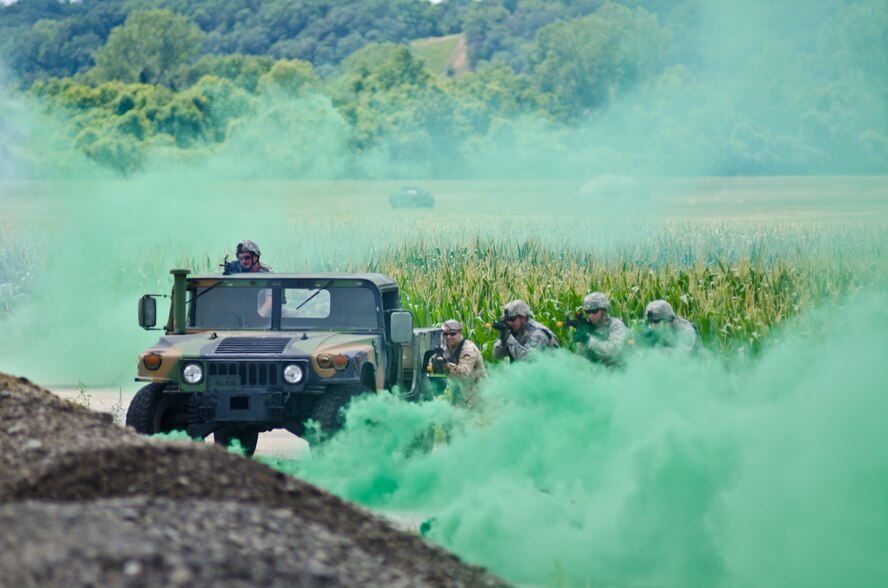 U.S. Airmen assigned to the Missouri Air National Guard’s 139th Security Forces Squadron participate in a training exercise involving airdrop support by a C-130 Hercules aircraft at Rosecrans Air National Guard base, Mo., July 17, 2013.  U.S. Air Force Gen. Paul J. Selva, commander of Air Mobility Command (AMC), and Chief Master Sgt.  Richard A. Kaiser, AMC command chief, observed the training exercise during a visit to Rosecrans and were briefed about 139th operations and the Advanced Airlift Tactics Training Center. (U.S. Air National Guard photo by Tech. Sgt. Michael Crane)