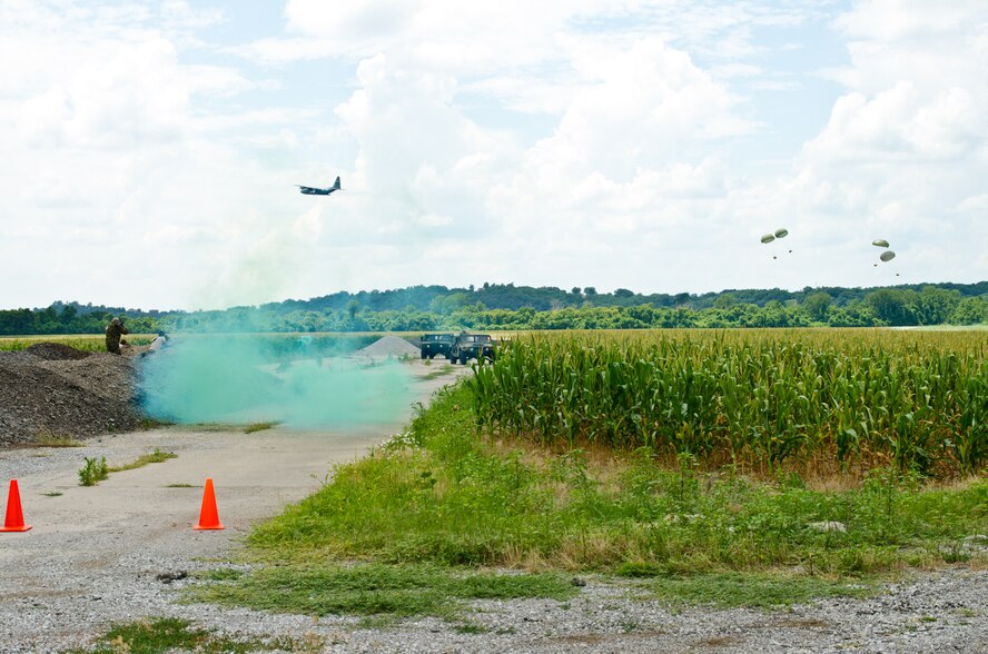 U.S. Airmen assigned to the Missouri Air National Guard’s 139th Security Forces Squadron participate in a training exercise involving airdrop support by a C-130 Hercules aircraft at Rosecrans Air National Guard base, Mo., July 17, 2013.  U.S. Air Force Gen. Paul J. Selva, commander of Air Mobility Command (AMC), and Chief Master Sgt.  Richard A. Kaiser, AMC command chief, observed the training exercise during a visit to Rosecrans and were briefed about 139th operations and the Advanced Airlift Tactics Training Center. (U.S. Air National Guard photo by Tech. Sgt. Michael Crane)