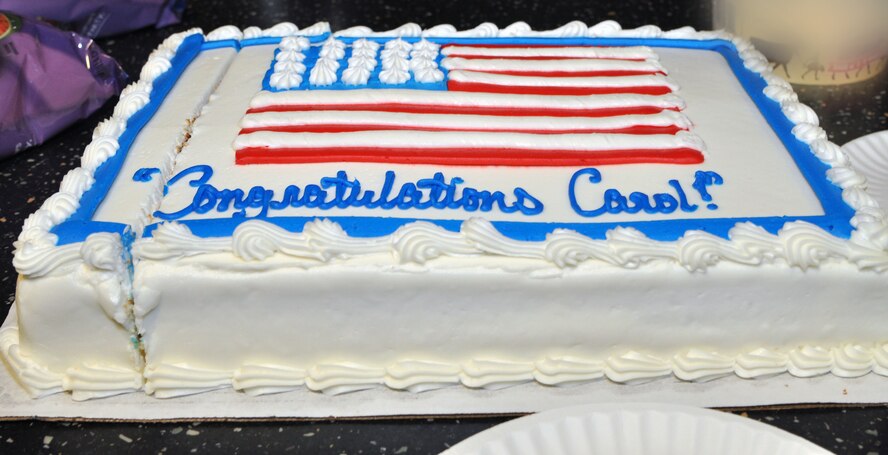 Chief Master Sgt. Carol Tripp, 303rd Fighter Squadron chief, celebrates her 38 years in the Air Force on her next-to-last day of work on July 23. The occasion was marked by a flyover of eight A-10 Thunderbolt II aircraft. The 303rd FS is part of the 442nd Fighter Wing, an A-10 Thunderbolt II Air Force Reserve unit at Whiteman Air Force Base, Mo. (U.S. Air Force photo by Senior Airman Wesley Wright/released)