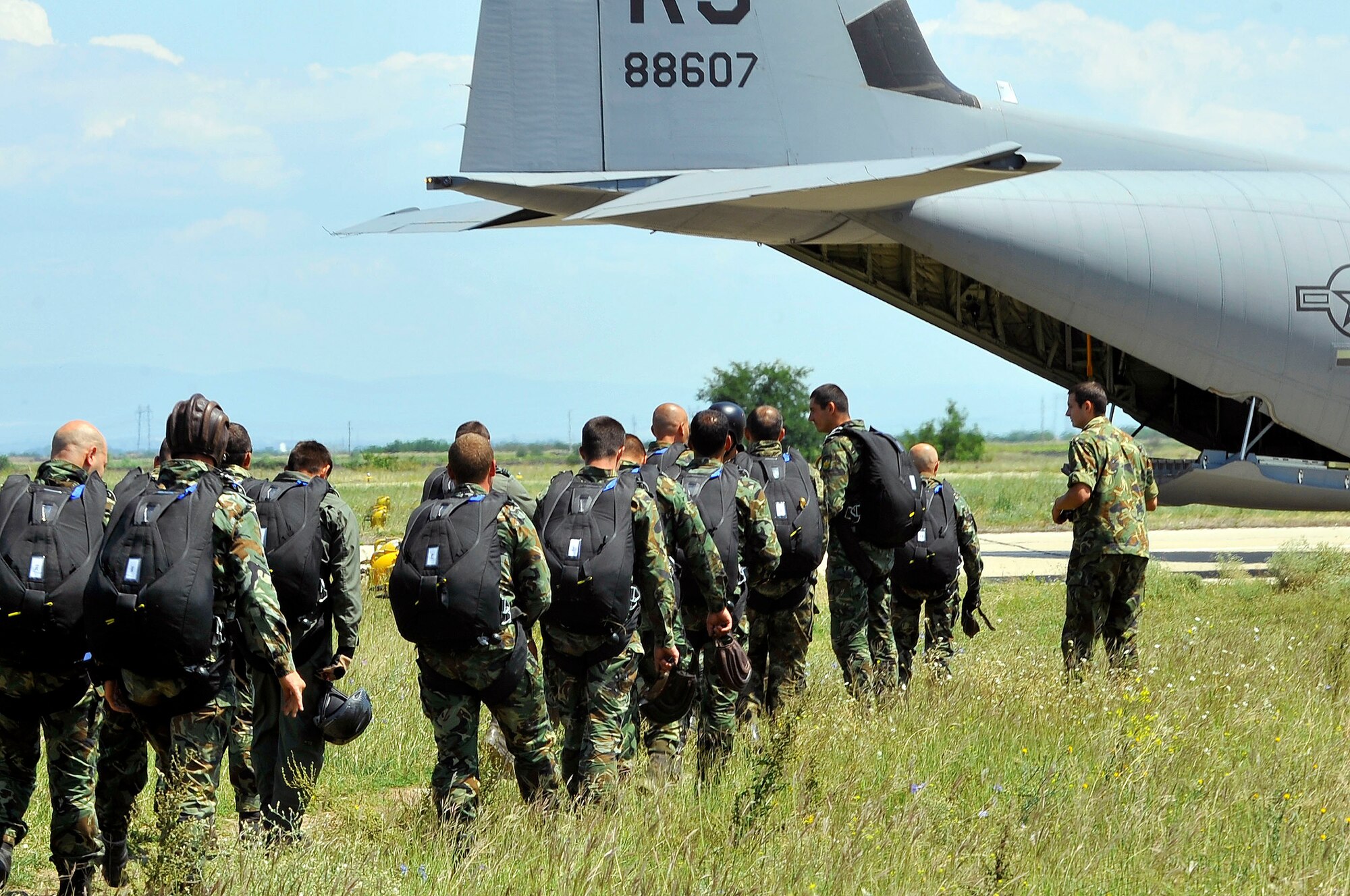 Bulgarian paratroopers stand by to board a C-130J Super Hercules to perform static-line jump training during a flying training deployment July 15, 2013, Plovdiv, Bulgaria. FTD Thracian Summer was a two-week training deployment for American and Bulgarian forces to work together and learn how each other perform their mission. (U.S. Air Force photo/Airman 1st Class Trevor Rhynes)