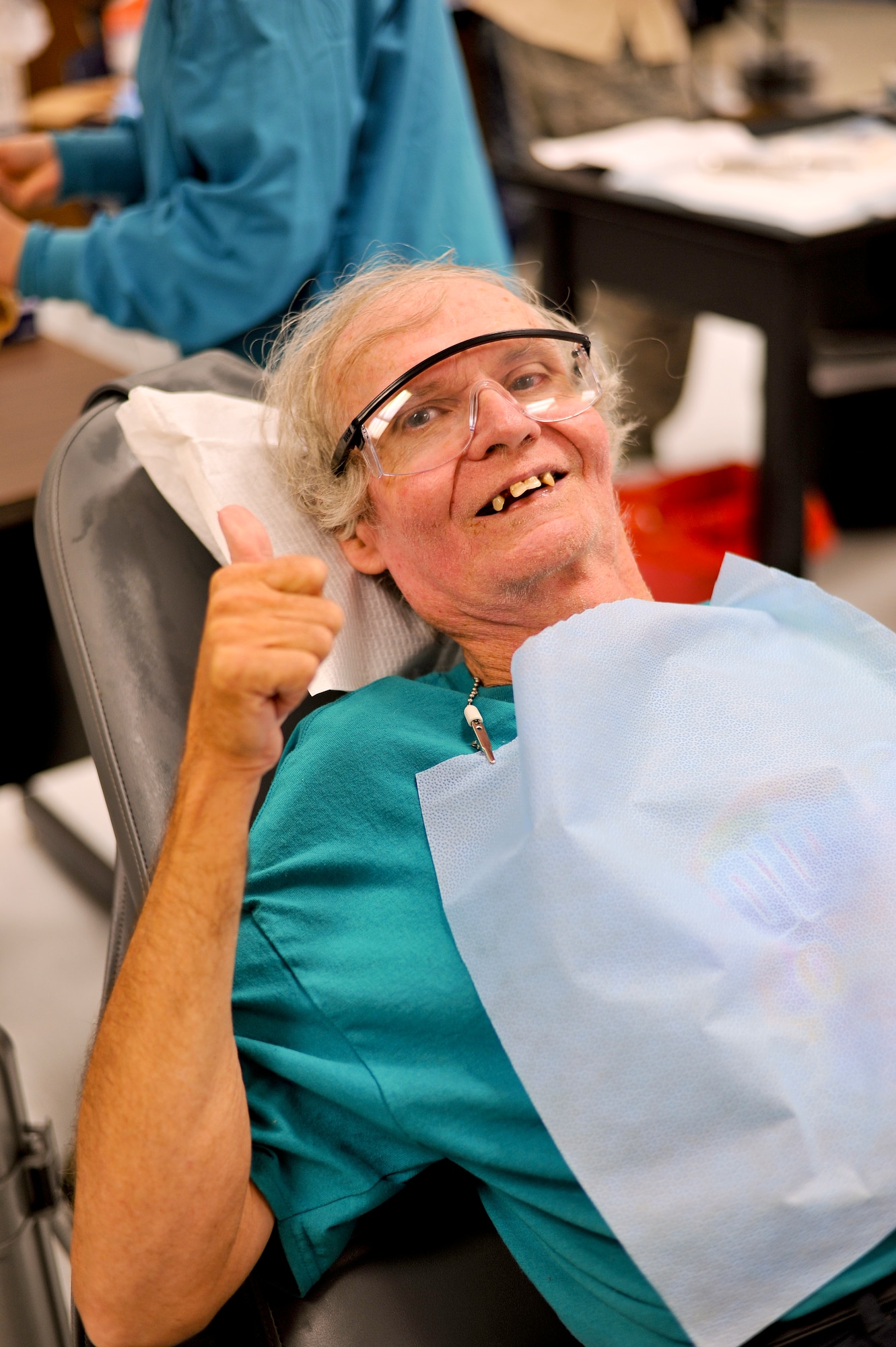 Edward Hicks, a resident of nearby Dresden, Tenn., shows his excitement before his second dental procedure in two weeks. Hicks visited Hope of Martin all but two days over the two-week event in order to see providers. On top of receiving a comprehensive optical exam and a new pair of glasses, also produced on-site, Hicks also had multiple dental procedures which included the extraction of 30 teeth badly in need of repair. Air National Guard photo by Master Sgt. Beth Holliker (Released).