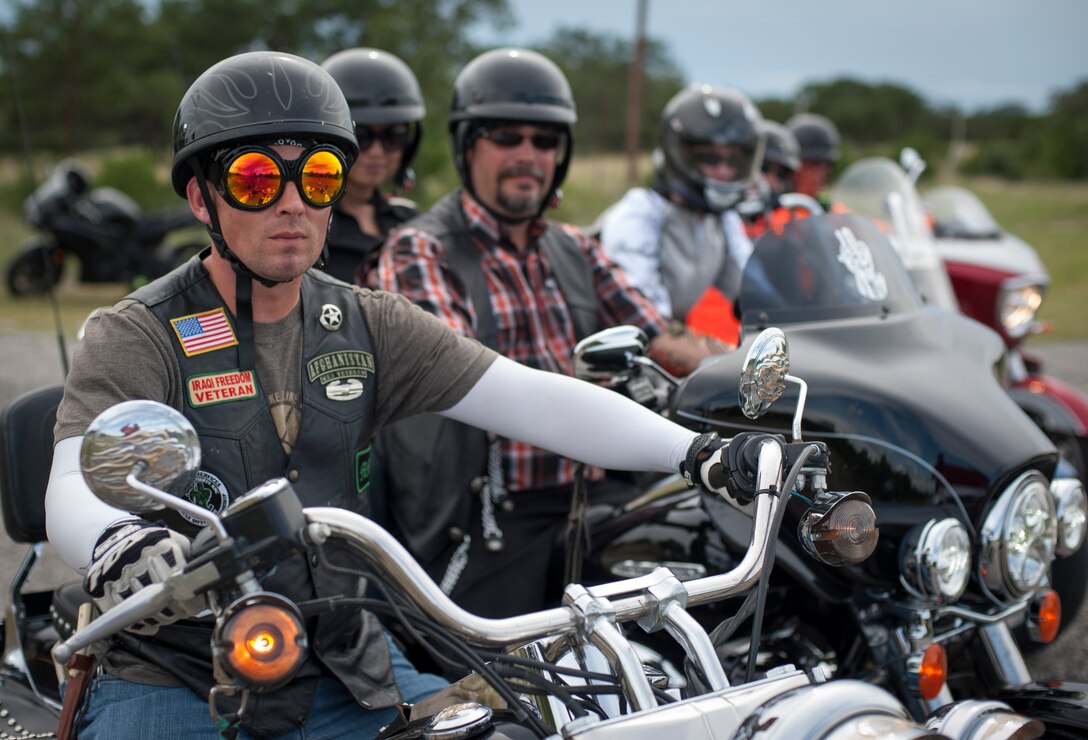 Members from the Green Knights Chapter 101 military motorcycle club pose for a picture July 20, 2013 near Del Rio, Texas. The club promotes camaraderie, mentorship and an increase in safety and awareness through group rides and events.