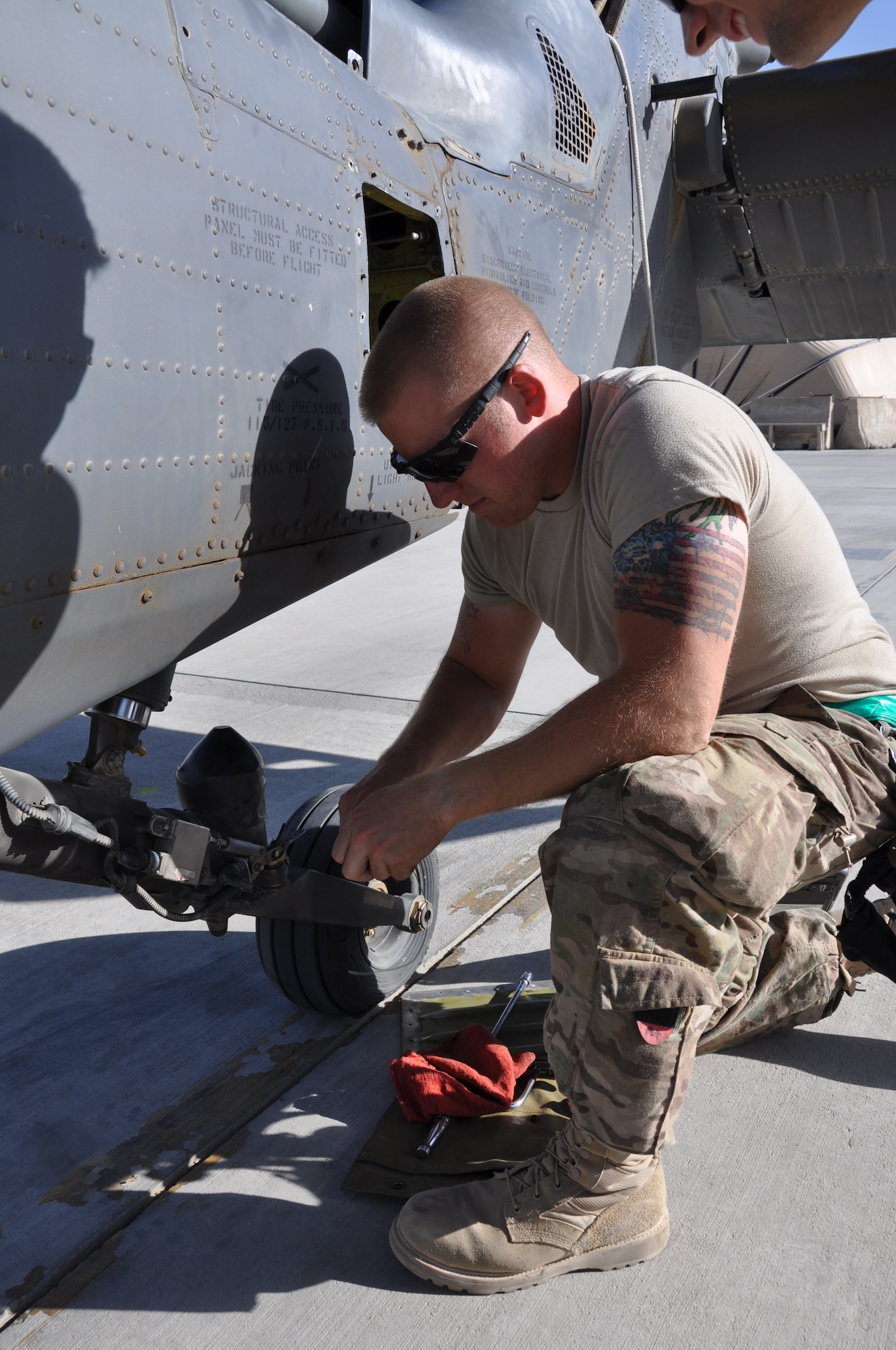Staff Sgt. Ryan Almy, 455th Expeditionary Maintenance Squadron, helps conduct a 50-hour preventative maintenance inspection on aircraft 89-6205, an HH-60G Pave Hawk helicopter assigned to the 56th Expeditionary Helicopter Maintenance Unit at Bagram Airfield, Afghanistan, July 24, 2013. The helo achieved the coveted black-letter initial exceptional release July 23, 2013, for the first time in the unit since 2005. After the ER was signed, the HH-60 launched as part of a mission attributed to saving two lives later the same day. Aircraft 89-6205 happens to be the same aircraft that attained the status for the unit eight years ago. (U.S. Air Force photo/Tech. Sgt. Rob Hazelett) 