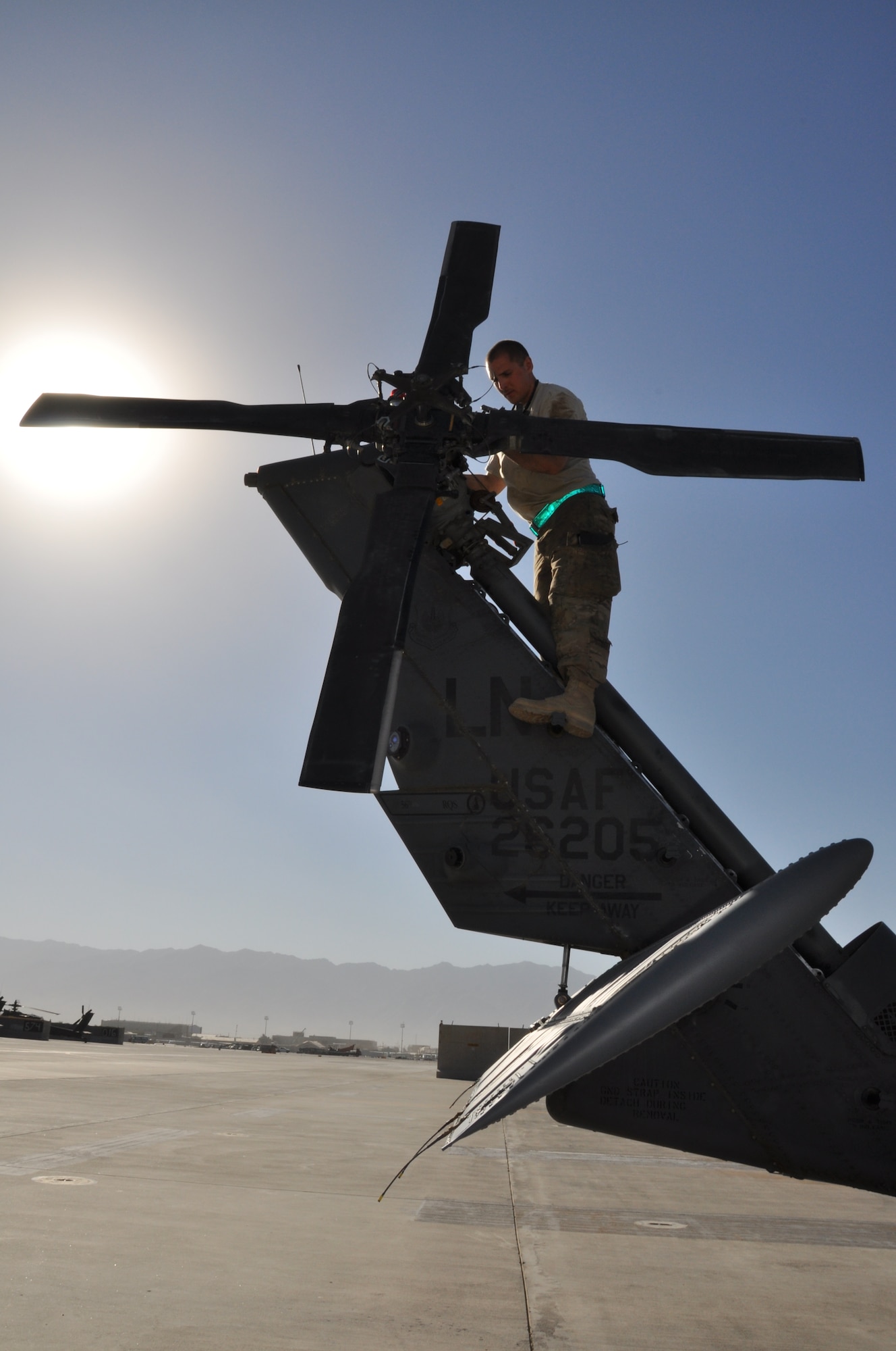 Airman 1st Class Andrew Willard, 455th Expeditionary Maintenance Squadron electronic warfare craftsmen assistant, helps conduct a 50-hour preventative maintenance inspection on aircraft 89-6205, an HH-60G Pave Hawk helicopter assigned to the 56th Expeditionary Helicopter Maintenance Unit at Bagram Airfield, Afghanistan, July 24, 2013. The helo achieved the coveted black-letter initial exceptional release July 23, 2013, for the first time in the unit since 2005. After the ER was signed, the HH-60 launched as part of a mission attributed to saving two lives later the same day. Aircraft 89-6205 happens to be the same aircraft that attained the status for the unit eight years ago. (U.S. Air Force photo/Tech. Sgt. Rob Hazelett)