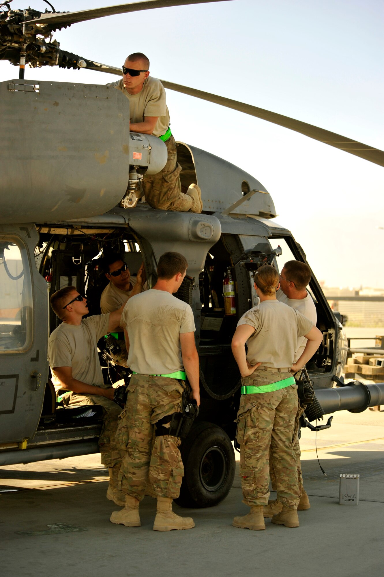 Service members from the 455th Expeditionary Maintenance Squadron conduct a 50-hour preventative maintenance inspection on aircraft 89-6205, an HH-60G Pave Hawk helicopter assigned to the 56th Expeditionary Helicopter Maintenance Unit at Bagram Airfield, Afghanistan, July 24, 2013. The Airmen, are deployed from the 748th Aircraft Maintenance Squadron at Royal Air Force Lakenheath, England. (U.S. Air Force photo/Staff Sgt. Stephenie Wade)