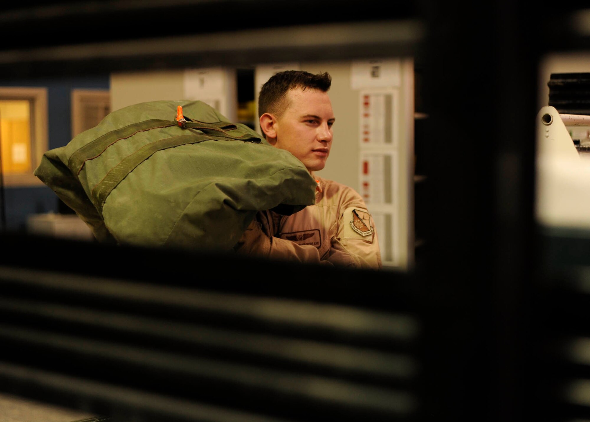Senior Airman Christopher Roland loads a bag packed with medical supplies onto a truck in preparation for an aeromedical evacuation mission at the 379th Air Expeditionary Wing in Southwest Asia, July 24, 2013. Roland is a 379th Expeditionary Aeromedical Evacuation Squadron aeromedical evacuation technician deployed from Kadena Air Base, Japan. (U.S. Air Force photo/Senior Airman Bahja J. Jones) 