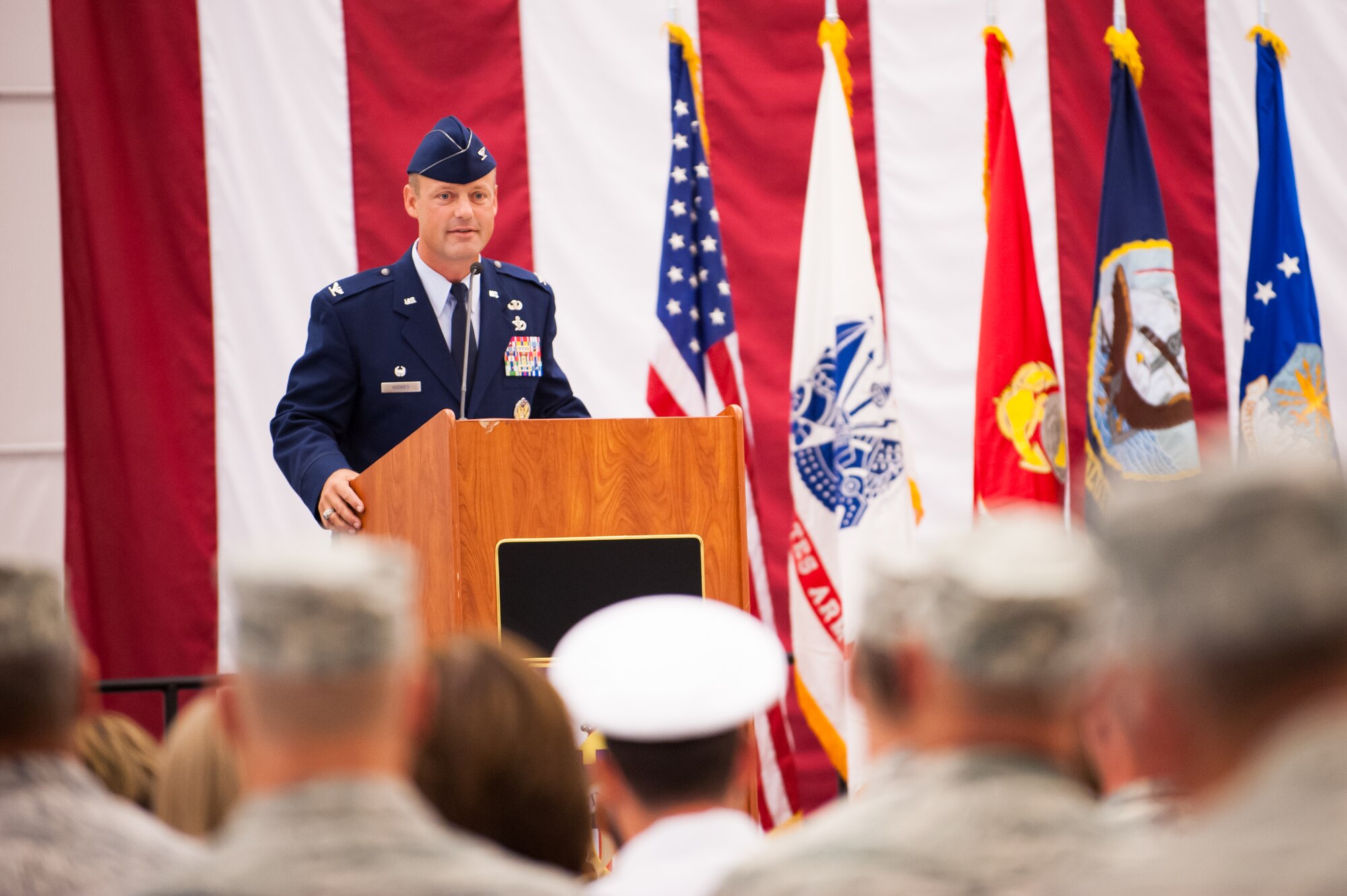 Col. James C. Hodges, 87th Air Base Wing and Joint Base McGuire-Dix-Lakehurst commander, addresses the service members and civilians assigned to the wing during a change of command ceremony, July 25, 2013, in Hangar 2201 on Joint Base McGuire-Dix-Lakehurst, N.J. (U.S. Air Force photo by Russ Meseroll/Released)
