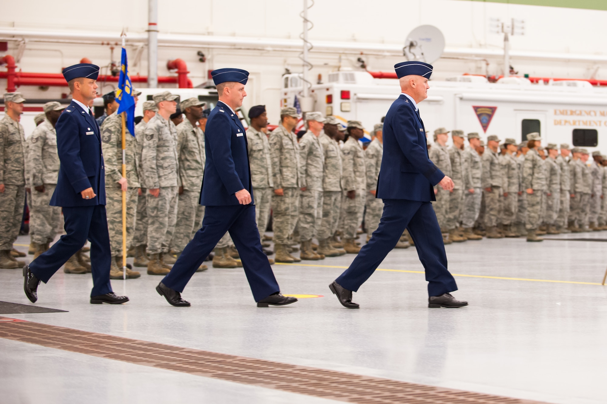 (From left to right) Col. James C. Hodges, Col. John M. Wood, 87th Air Base Wing and Joint Base commander, and Brig. Gen. Randall C. Guthrie, U.S. Air Force Expeditionary Center commander, enter the 87th Air Base Wing Change of Command Ceremony July 25, 2013, in hangar 3370 on Joint Base McGuire-Dix-Lakehurst, N.J. During the event Wood relinquished command to Hodges. (U.S. Air Force photo by Russ Meseroll/Released)