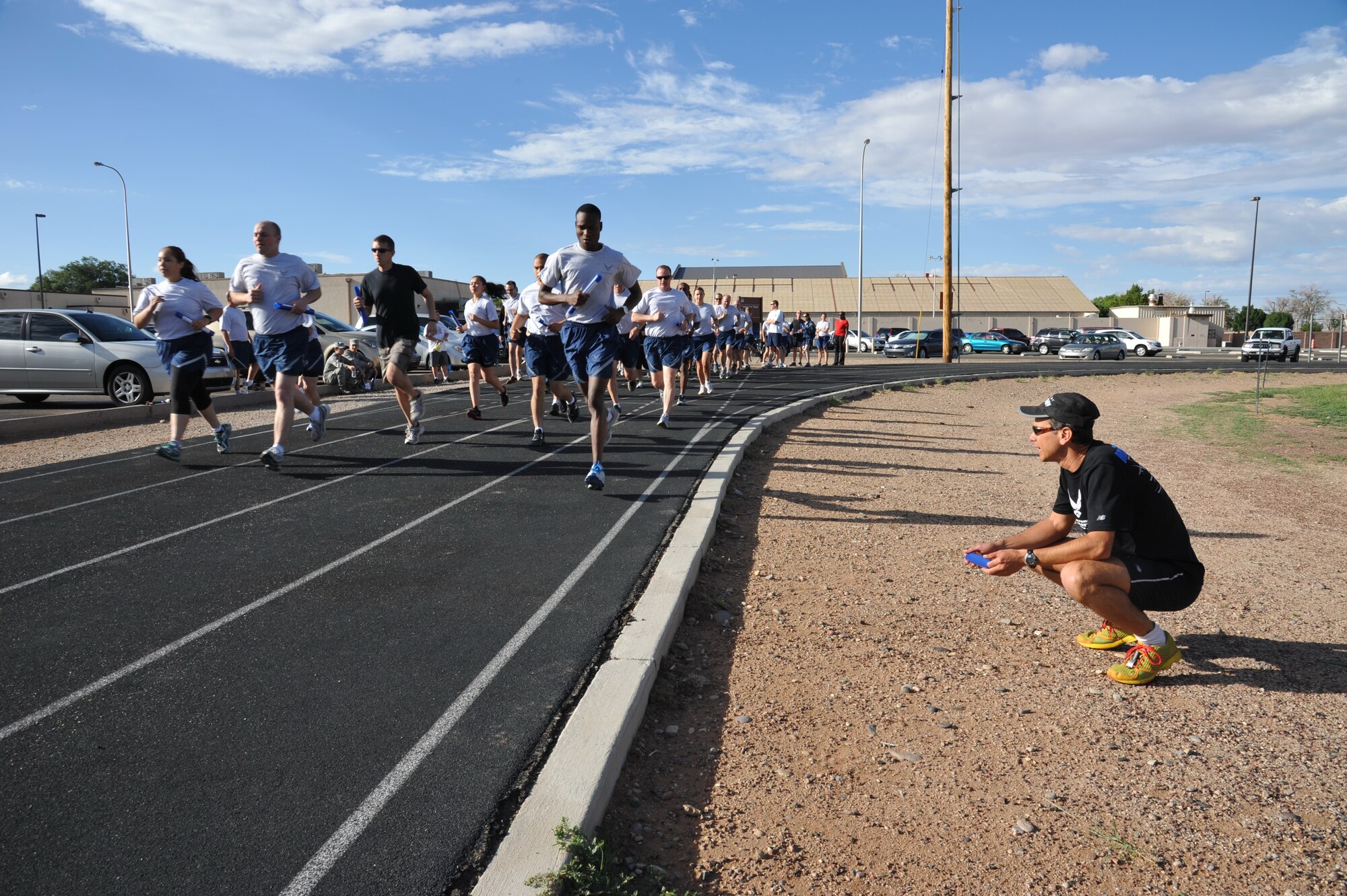 Dr. Antonio Eppolito, five-time Air Force half marathon champion, observes posture and technique of participants of the running clinic. The free clinic was hosted by the Health and Wellness Center. (Photo by Ken Moore)
