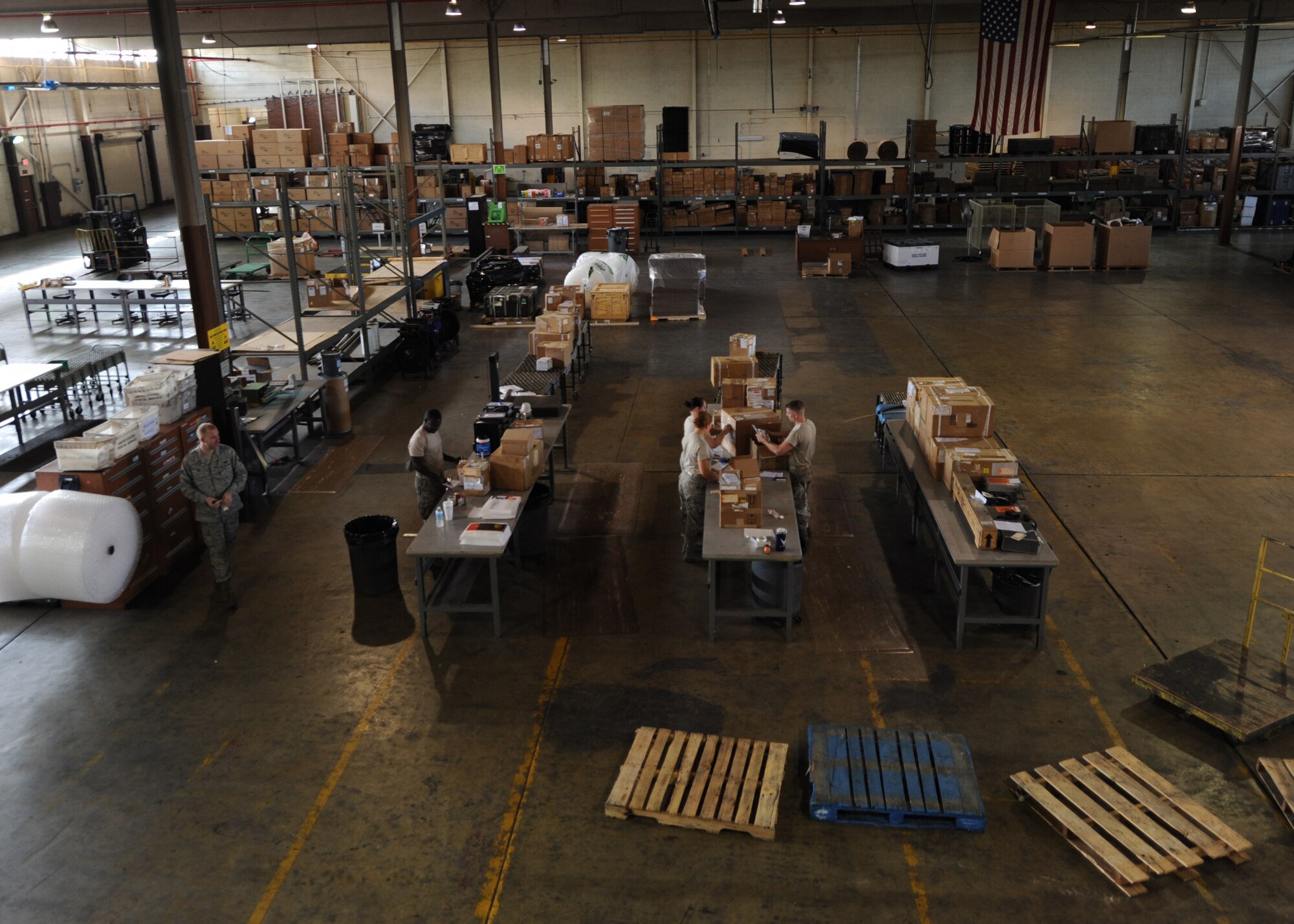 Airmen from the 2nd Logistics Readiness Squadron shipment distribution center package cargo on Barksdale Air Force Base, La., July 25, 2013. The shipment distribution center handles more than 10 shipments of cargo per week that come through the base. (U.S. Air Force photo/Senior Airman Sean Martin)

