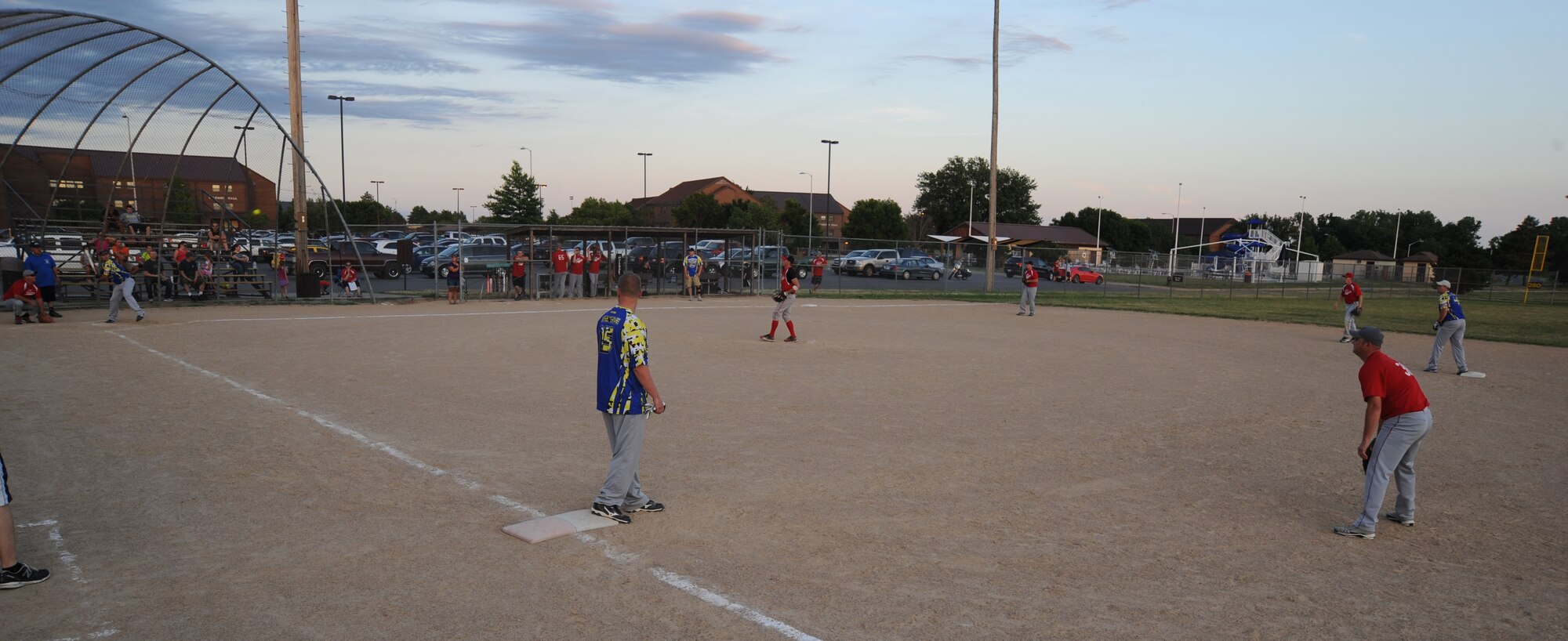 Members of the Civil Engineering softball team face off against the Security Forces-A softball team at Whiteman Air Force Base, Mo., July 22, 2013. CE won the game 16-6, claiming first place in the base league. (U.S. Air Force photo by Airman 1st Class Bryan Crane/Released)