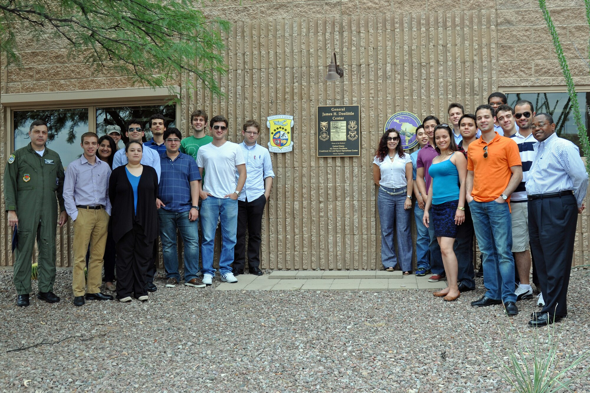 Graduate and doctoral engineering students from Brazil pose for a picture at the 612th Air and Space Operations Center with Col. Paulo Vasconcellos, Brazilian Air Force liaison officer to Headquarters Twelfth Air Force (Air Forces Southern), during a tour of Davis-Monthan Air Force Base, July 24. The students were in Tucson, Ariz., visiting the nearby Raytheon Company as part of Brazil’s Science Without Borders program and requested the opportunity to visit D-M. The 612th AOC provides command and control of U.S. air and space assets 24-hours-a-day to support joint and coalition efforts in the Caribbean, Central America and South America.  (U.S. Air Force photo/Capt. Jonathan Simmons)