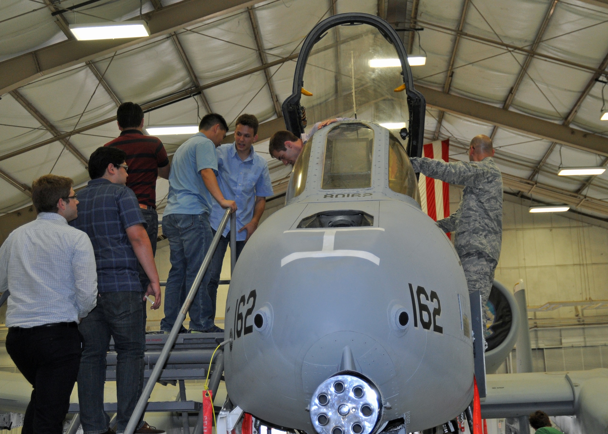 Graduate and doctoral engineering students from Brazil get an up-close look at the U.S. Air Force A-10 Thunderbolt II during a tour at Davis-Monthan Air Force Base, July 24. The students were in Tucson, Ariz., visiting the nearby Raytheon Company as part of Brazil’s Science Without Borders program and requested the opportunity to visit D-M.  The A-10 is a close air support aircraft that has proven invaluable to the United States and its allies in operations including Desert Storm, Southern Watch, Provide Comfort, Desert Fox, Noble Anvil, Deny Flight, Deliberate Guard, Allied Force, Enduring Freedom and Iraqi Freedom. (U.S. Air Force photo/Capt. Jonathan Simmons)