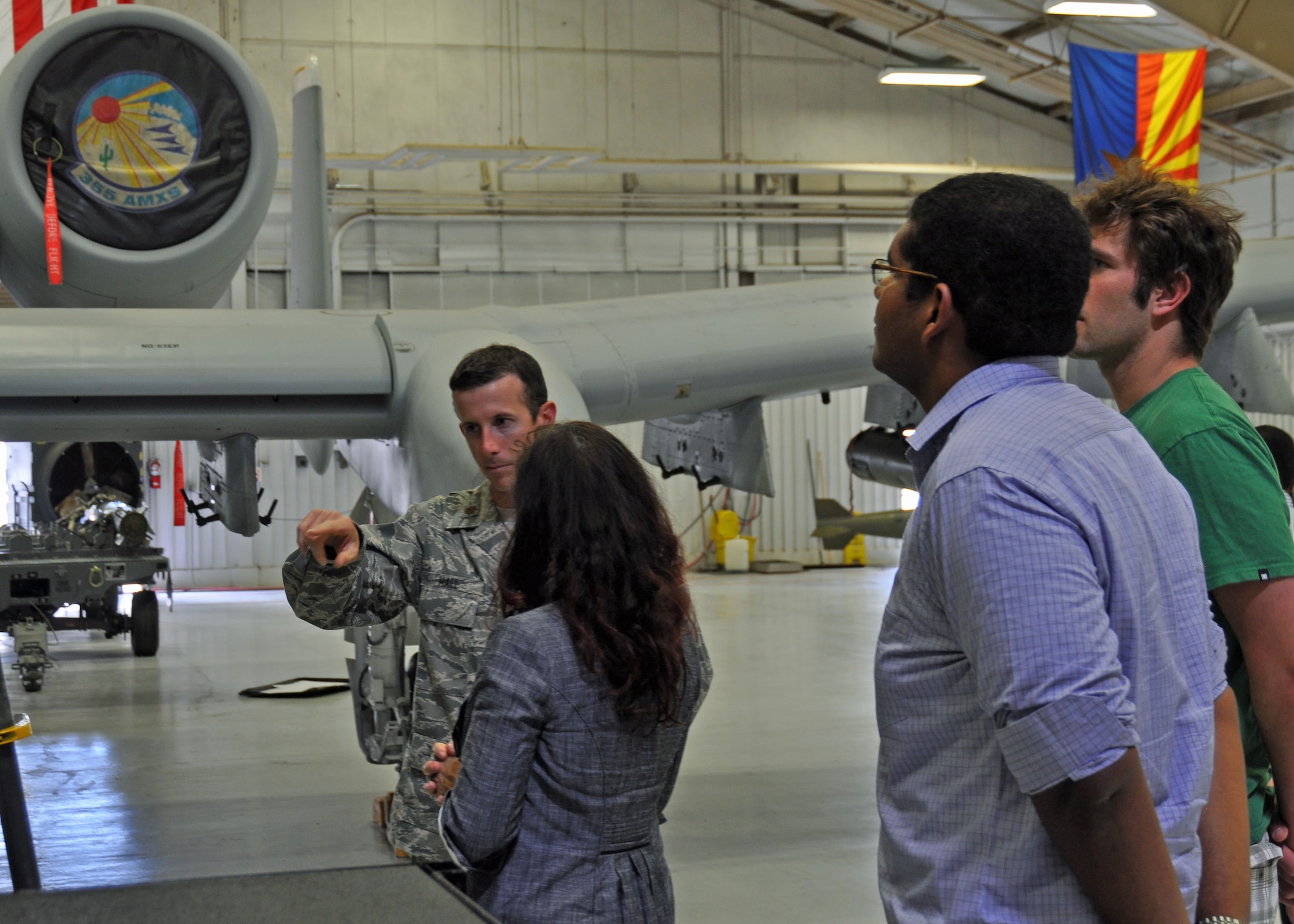 Graduate and doctoral engineering students from Brazil discuss the capabilities of the U.S. Air Force A-10 Thunderbolt II with Maj. Sean Hall, an A-10 pilot assigned to Headquarters Twelfth Air Force (Air Forces Southern), at Davis-Monthan Air Force Base, July 24. The students were in Tucson, Ariz., visiting the nearby Raytheon Company as part of Brazil’s Science Without Borders program and requested the opportunity to visit D-M.  The A-10 is a close air support aircraft that has proven invaluable to the United States and its allies in operations including Desert Storm, Southern Watch, Provide Comfort, Desert Fox, Noble Anvil, Deny Flight, Deliberate Guard, Allied Force, Enduring Freedom and Iraqi Freedom. (U.S. Air Force photo/Capt. Jonathan Simmons)