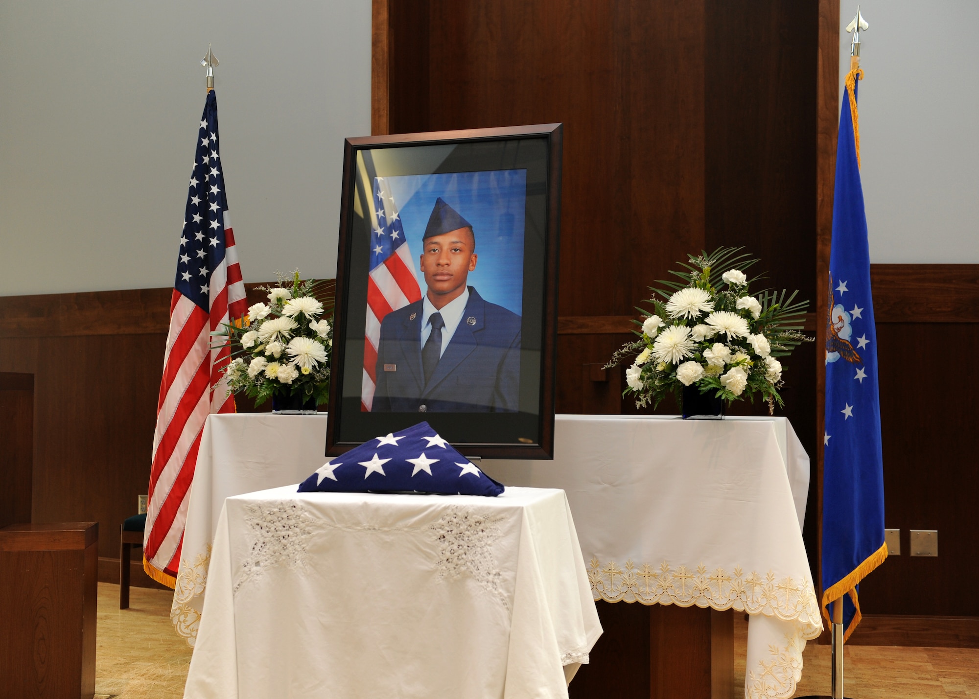A portrait of Airman 1st Class Shaquille Hargrove is displayed at the chapel July 24, 2013, on Buckley Air Force Base, Colo. The chapel was filled to standing-room-only capacity for Hargrove, a 2nd Space Warning Squadron satellite systems operator, who was killed in an incident at 15th and Market Streets in downtown Denver July 13. (U.S. Air Force photo by Senior Airman Marcy Glass/Released)