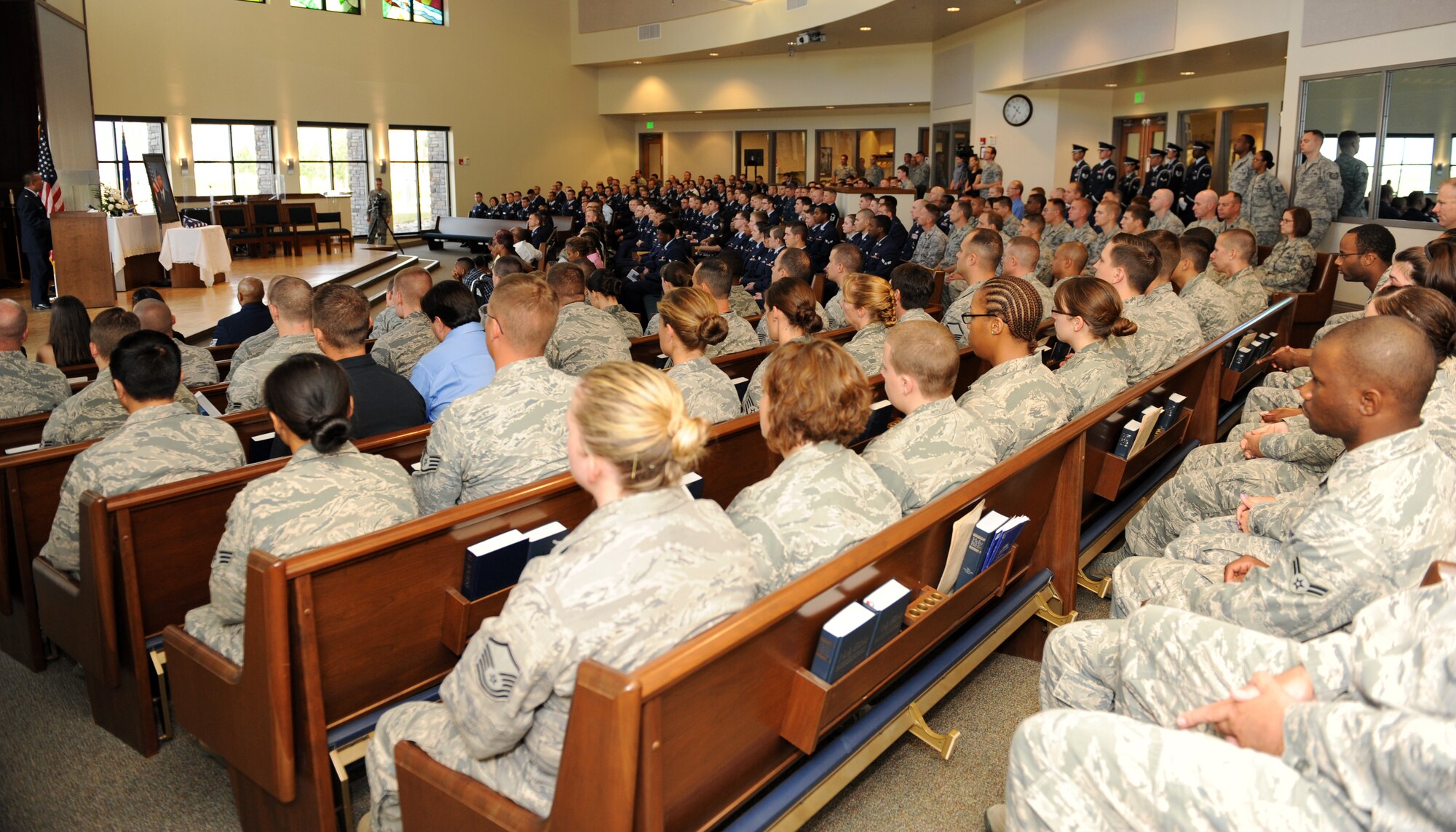 Team Buckley members gathered for Airman 1st Class Shaquille Hargrove’s memorial service July 24, 2013, at the chapel on Buckley Air Force Base, Colo. The chapel was filled to standing-room-only capacity for Hargrove, a 2nd Space Warning Squadron satellite systems operator, who was killed in an incident at 15th and Market Streets in downtown Denver July 13. (U.S. Air Force photo by Senior Airman Marcy Glass/Released)