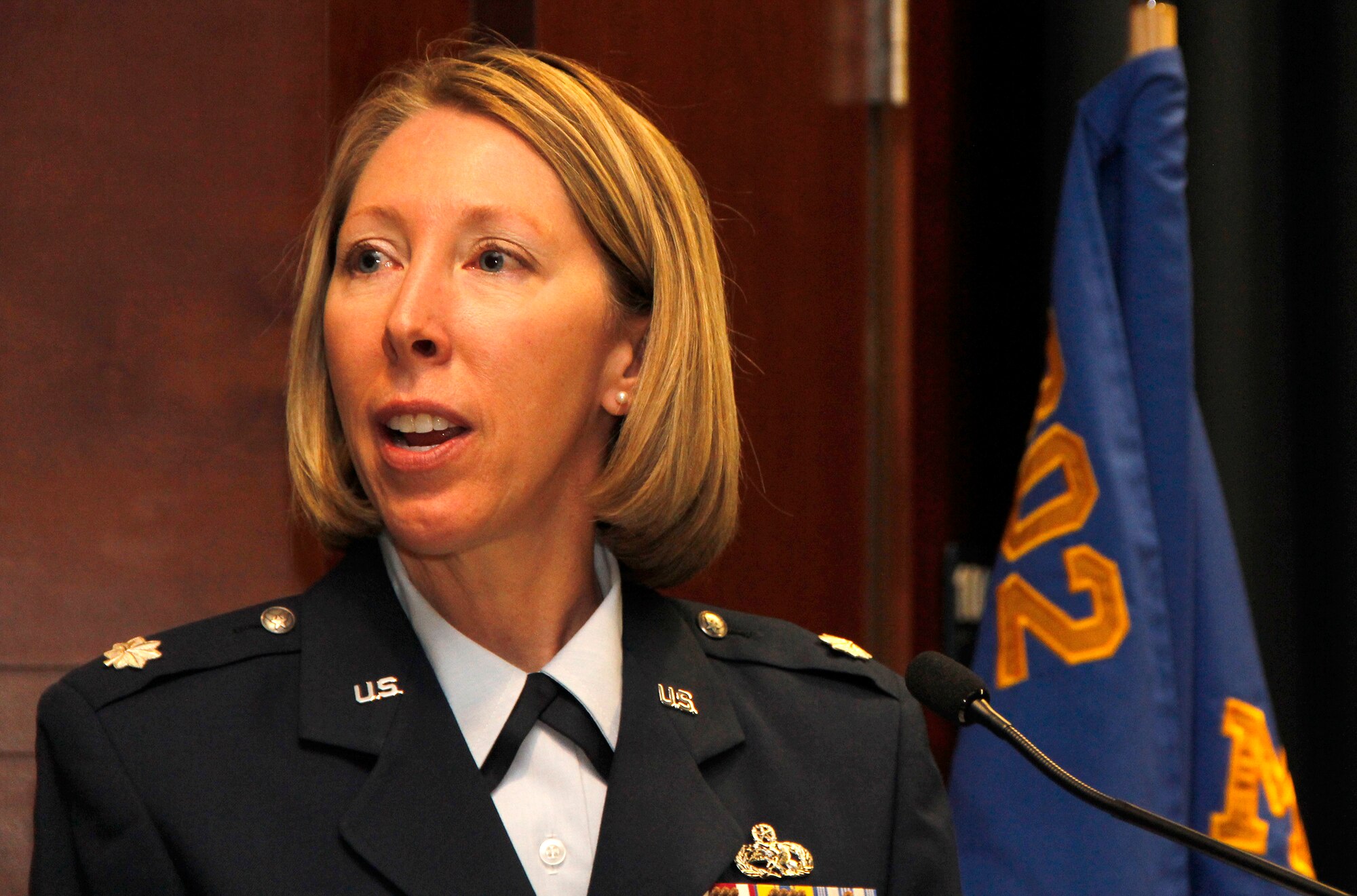 Air Force Reserve Lt. Col. Jennifer Cummings addresses the crowd after taking command of the 302nd Maintenance Group July 14 at Peterson Air Force Base, Colo. She has deployed on several occasions as an aircraft maintenance officer. (U.S. Air Force photo/Staff Sgt. Nathan Federico)