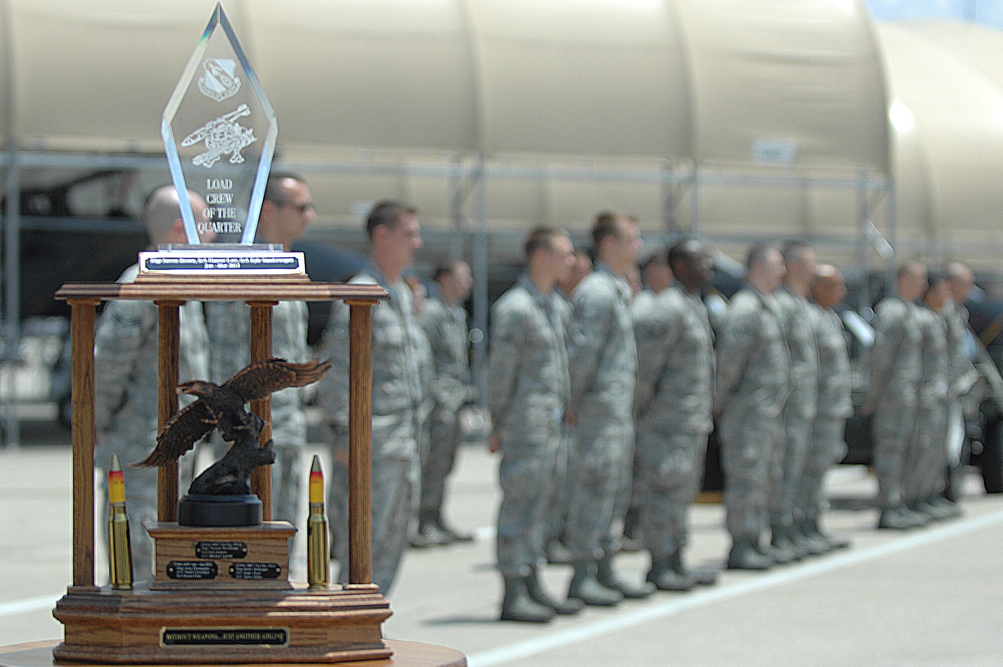 Airmen assigned to the 4th Aircraft Maintenance Squadron prepare to have their uniforms inspected before participating in a load crew of the quarter competition at Seymour Johnson Air Force Base, N.C., July 19, 2013.  One crew from each of the four aircraft maintenance squadrons was selected to compete for the load crew trophy and bragging rights.  (U.S. Air Force photo by Airman 1st Class Brittain Crolley/Released)