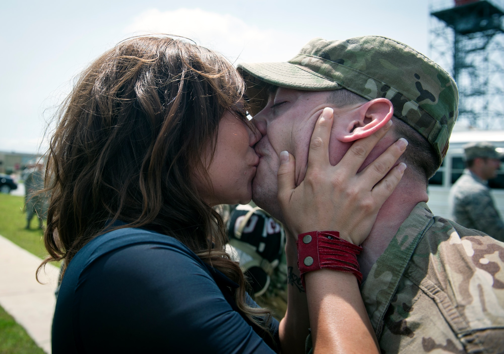 U.S. Staff Sgt. Jock Whatley kisses his wife, Chantal, during an 822nd Base Defense Squadron deployment return at Moody Air Force Base, Ga., July 24, 2013. Approximately 110 Airmen from the 822nd BDS is scheduled to return from Bagram Airfield, Afghanistan, within a four-day span. (U.S. Air Force photo by Senior Airman Jarrod Grammel/Released)
