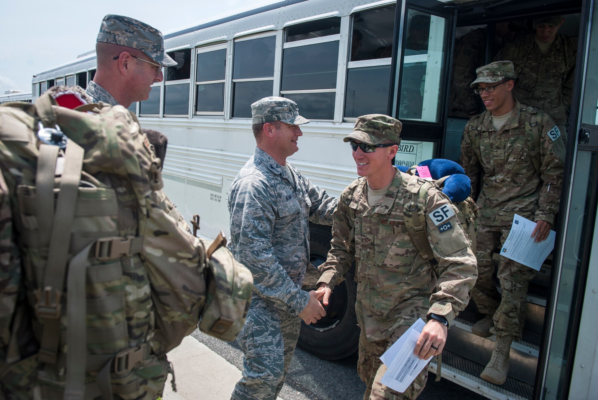 U.S. Air Force Col. Samuel Milam, 93d Air Ground Operations Wing commander, and other 93d AGOW leadership welcome 822nd Base Defense Squadron Airmen home at Moody Air Force Base, Ga., July 24, 2013. The Airmen deployed for six months to Bagram Airfield, Afghanistan. (U.S. Air Force photo by Senior Airman Jarrod Grammel/Released)

