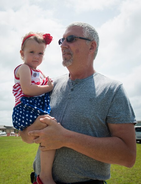 U.S. Air Force Staff Sgt. Jonathan Royse’s father, Johnny Royse, and daughter, Maci Royse, wait for him to return from deployment at Moody Air Force Base, Ga., July 24, 2013. Royse and fellow Airmen from the 822nd Base Defense Squadron deployed to Bagram Airfield, Afghanistan, in December 2012. (U.S. Air Force photo by Senior Airman Jarrod Grammel/Released)
