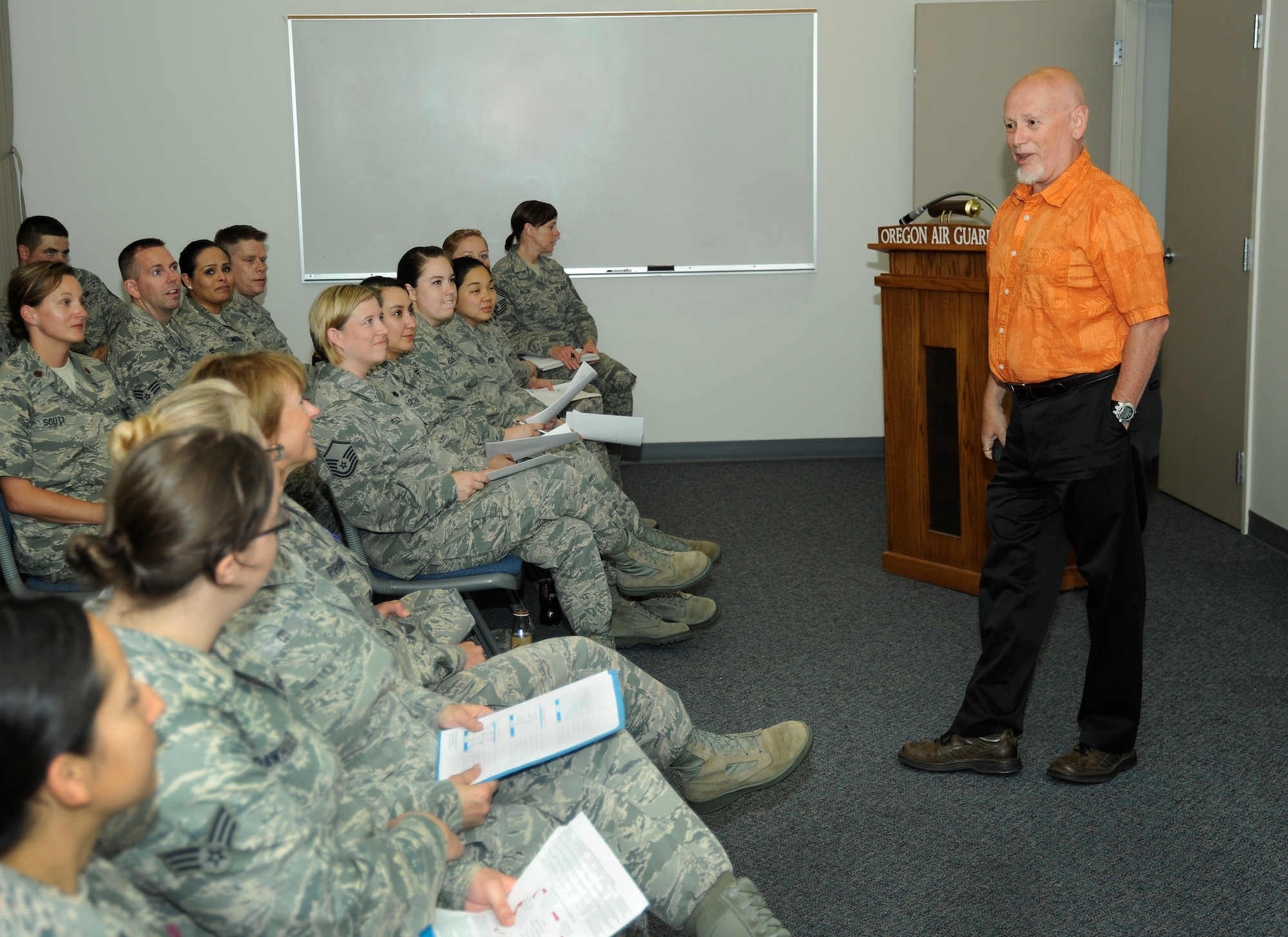 Dr. Allen Cabelly, a professor in Human Resource Management and Leadership at Portland State University, discusses generational differences in the workplace to Airmen of the 142nd Fighter Wing Force Support Squadron at the Portland Air National Guard Base, Ore., July 14, 2013. (Air National Guard photo by Tech. Sgt. John Hughel, 142nd Fighter Wing Public Affairs)