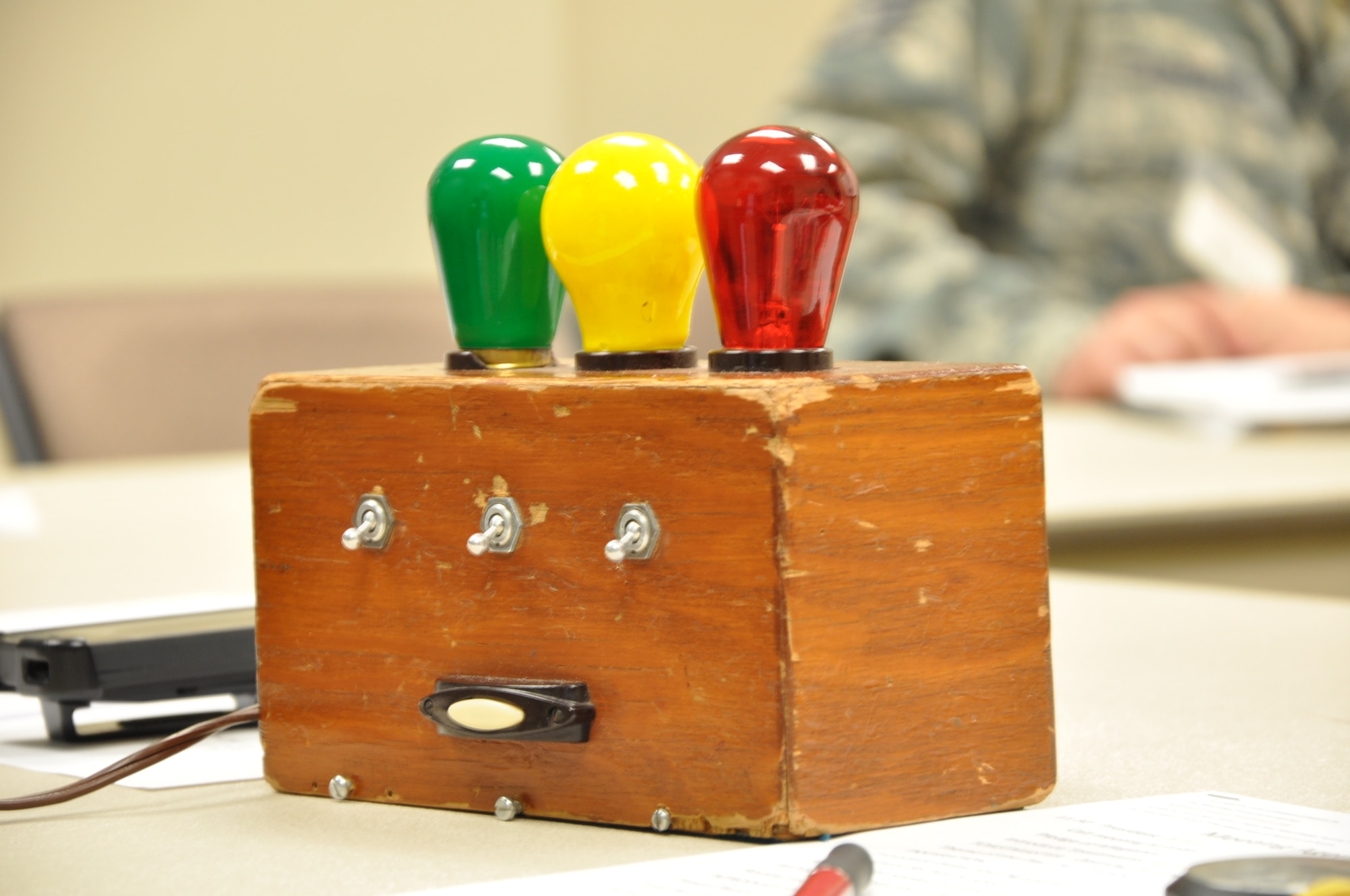 The Defenders of Speech Toastmasters Club uses a box with colored lights to alert members giving speeches of time limits July 10, 2013, at the Buckley Chapel on Buckley Air Force Base, Colo. The club meets bi-monthly at the chapel as a branch of the international group Toastmasters, a volunteer organization dedicated to teaching and developing public presentation and leadership skills. The club is open to anyone with access to base. (U.S. Air Force photo by Master Sgt. Christian Michael)