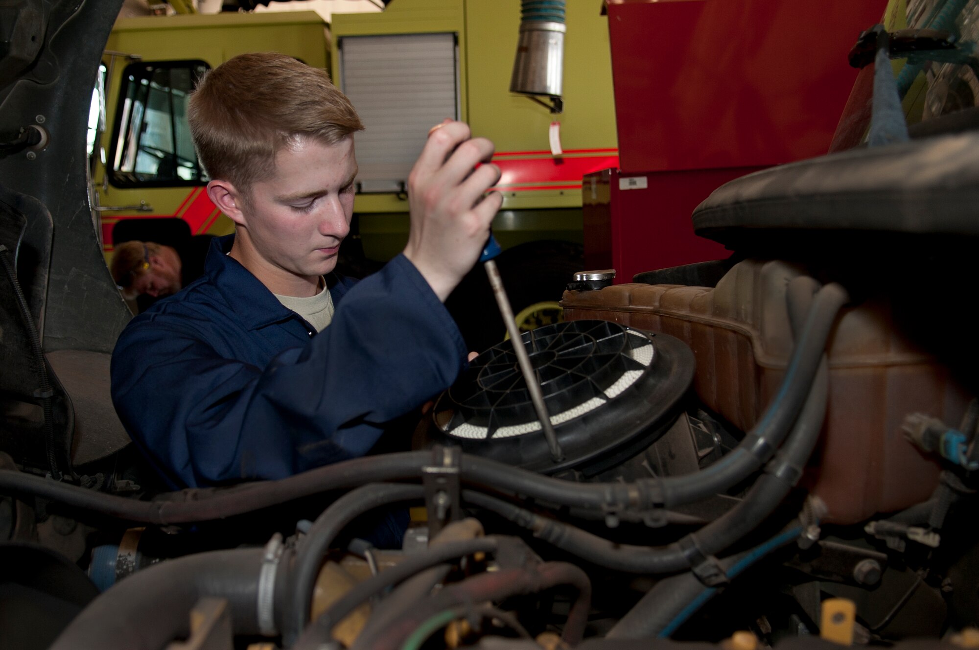 ALTUS AIR FORCE BASE, Okla. – Airman Tanner Peterson, 97th Logistics Readiness Squadron fire truck and refueling maintenance shop mechanic, checks the air filter of a R-12 refueling vehicle for debris or damage during a routine maintenance inspection inside the vehicle maintenance shop, July 23. The R-12 refueling vehicle brings jet fuel from storage tanks to the flightline hot pits and aircraft to keep the training mission going. (U.S. Air Force photo by Senior Airman Dillon Davis/Released)
