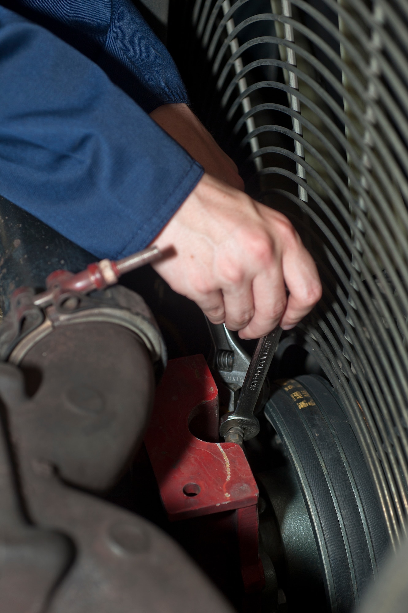 ALTUS AIR FORCE BASE, Okla. – Airman Tanner Peterson, 97th Logistics Readiness Squadron fire truck and refueling maintenance shop mechanic, disconnects an air line in the engine compartment of a P-23 crash truck during a preventative maintenance inspection inside the vehicle maintenance shop, July 23. The P-23 crash truck requires scheduled maintenance inspections after every 150 hours of drive time to guarantee constant preparedness for base emergency response. (U.S. Air Force photo by Senior Airman Dillon Davis/Released)