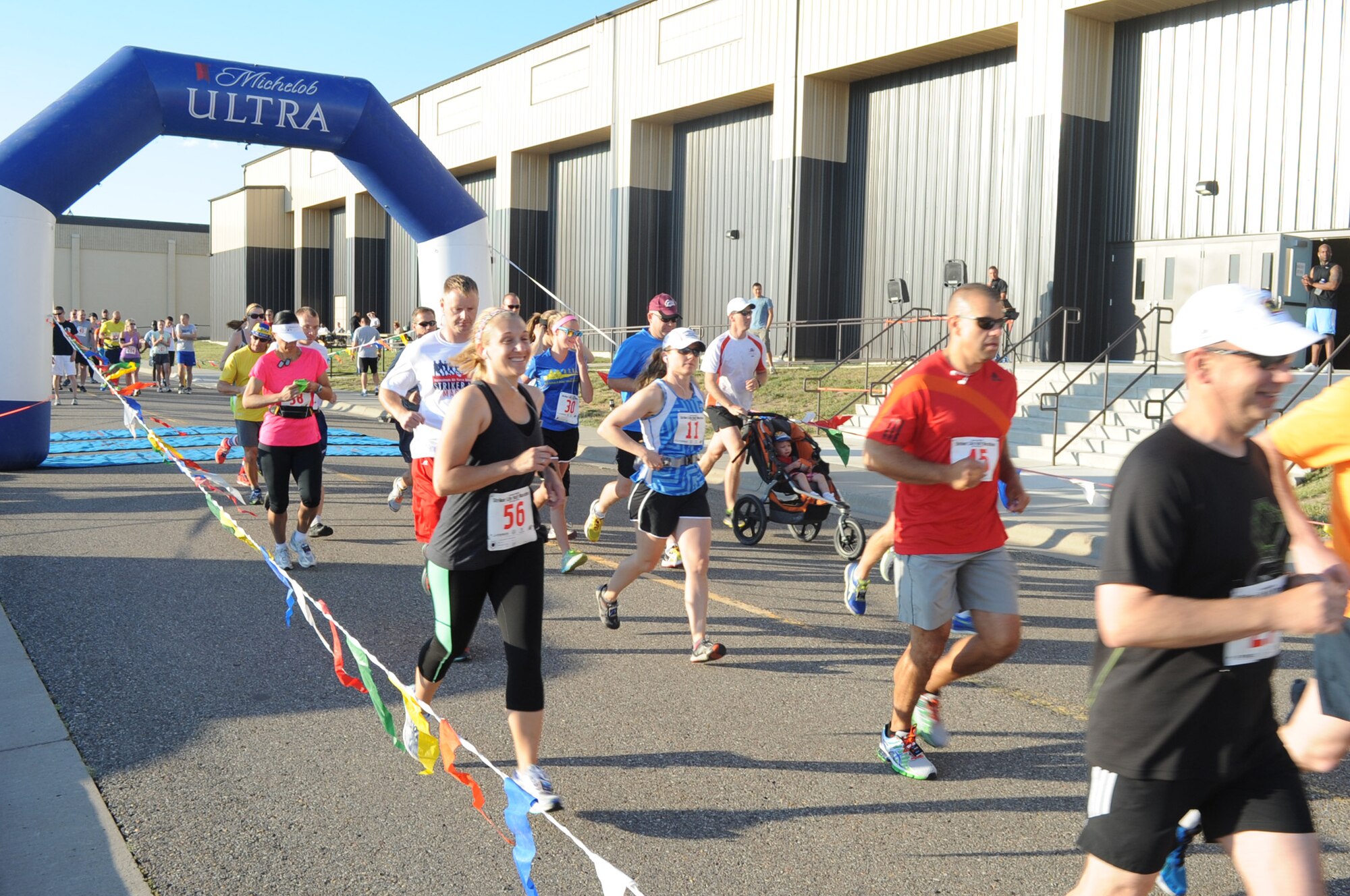 Runners take off during the Second Annual Striker Life Half Marathon for the thirteen-mile-long run. Water stations were set up at the 5K, 10K and half marathon turnaround points during the race for runners to hydrate and refuel along the way. (U.S. Air Force photo/Airman 1st Class Collin Schmidt)