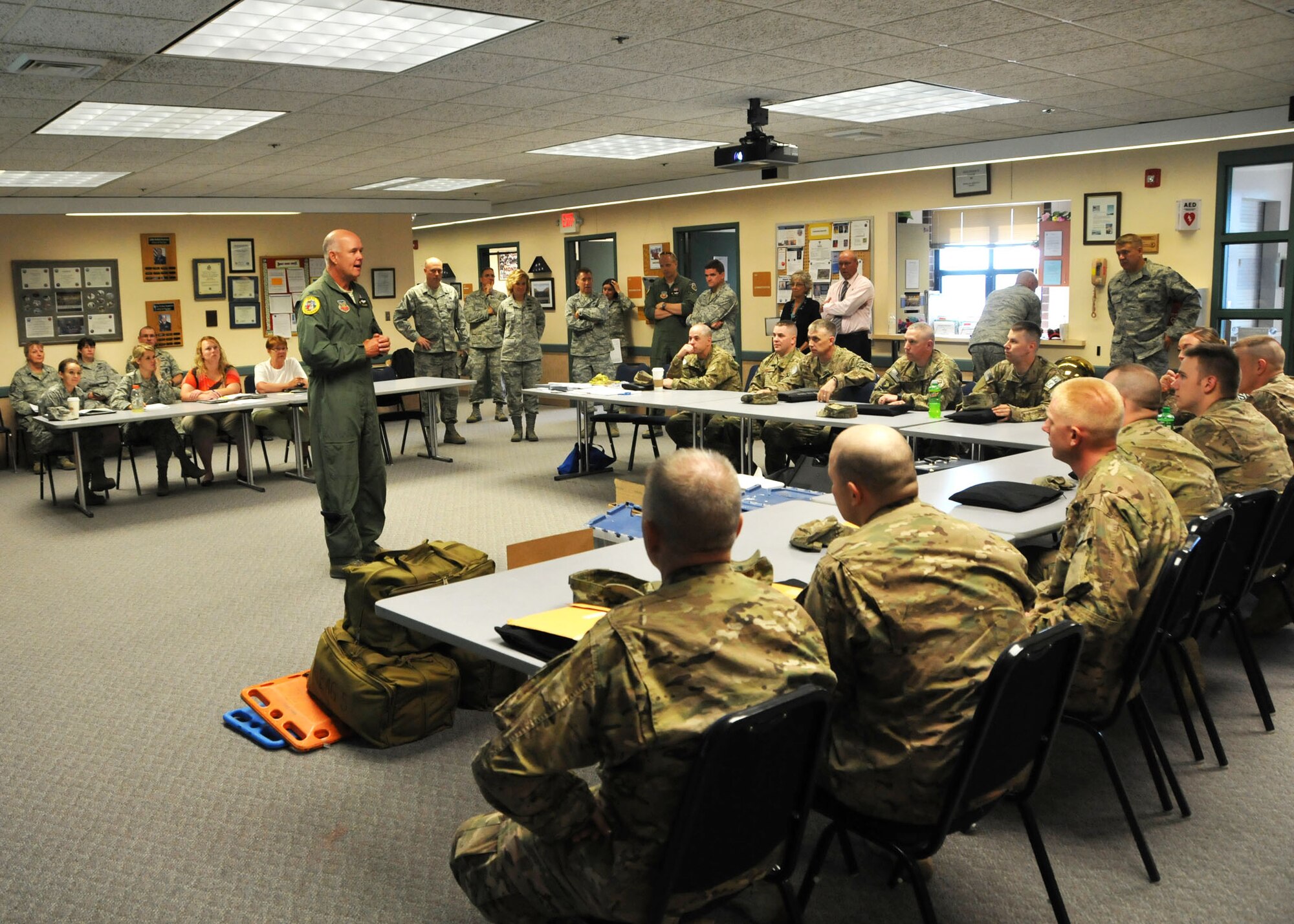 Col. J. Peter Hronek, 120th Fighter Wing commander, thanks 14 members of the 120th Security Forces Squadron for participating in a six-month overseas deployment in support of Operation Enduring Freedom.  The Airmen were beginning their in-processing activities on July 16.  (U.S. Air Force photo/Senior Master Sgt. Eric Peterson) 
