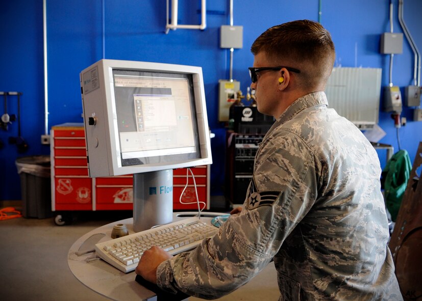 U.S. Air Force Senior Airman Robert Mason, 354th Maintenance Squadron metals technology journeyman, engineers a design for an aircraft part using computer aided design technology at Eielson Air Force Base, Alaska, July 22, 2013. After metals tech Airmen design a part, a water jet, or CNC machine will cut the design with precision accuracy. (U.S. Air Force Senior Airman Shawn Nickel/Released)