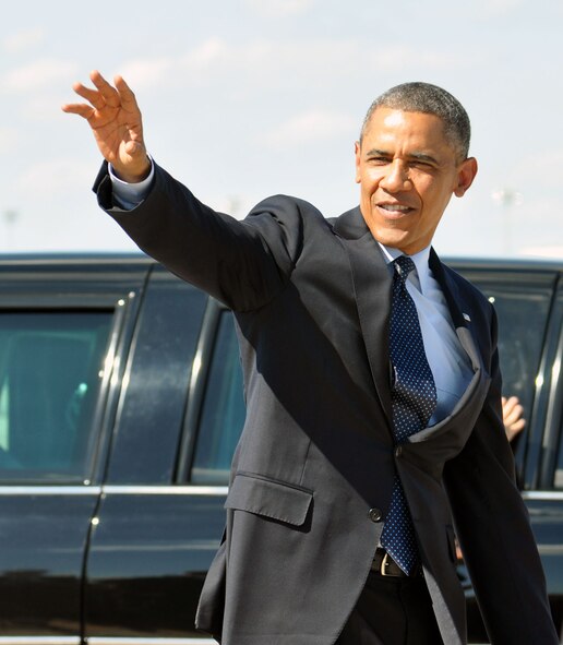 President Barack Obama waves to the public at Whiteman Air Force Base on July 24. Obama visited with Airmen and distinguished visitors before traveling to the University of Central Missouri, Warrensburg, Mo., to deliver a speech. (U.S. Air Force photo by Senior Airman Wesley Wright/released)