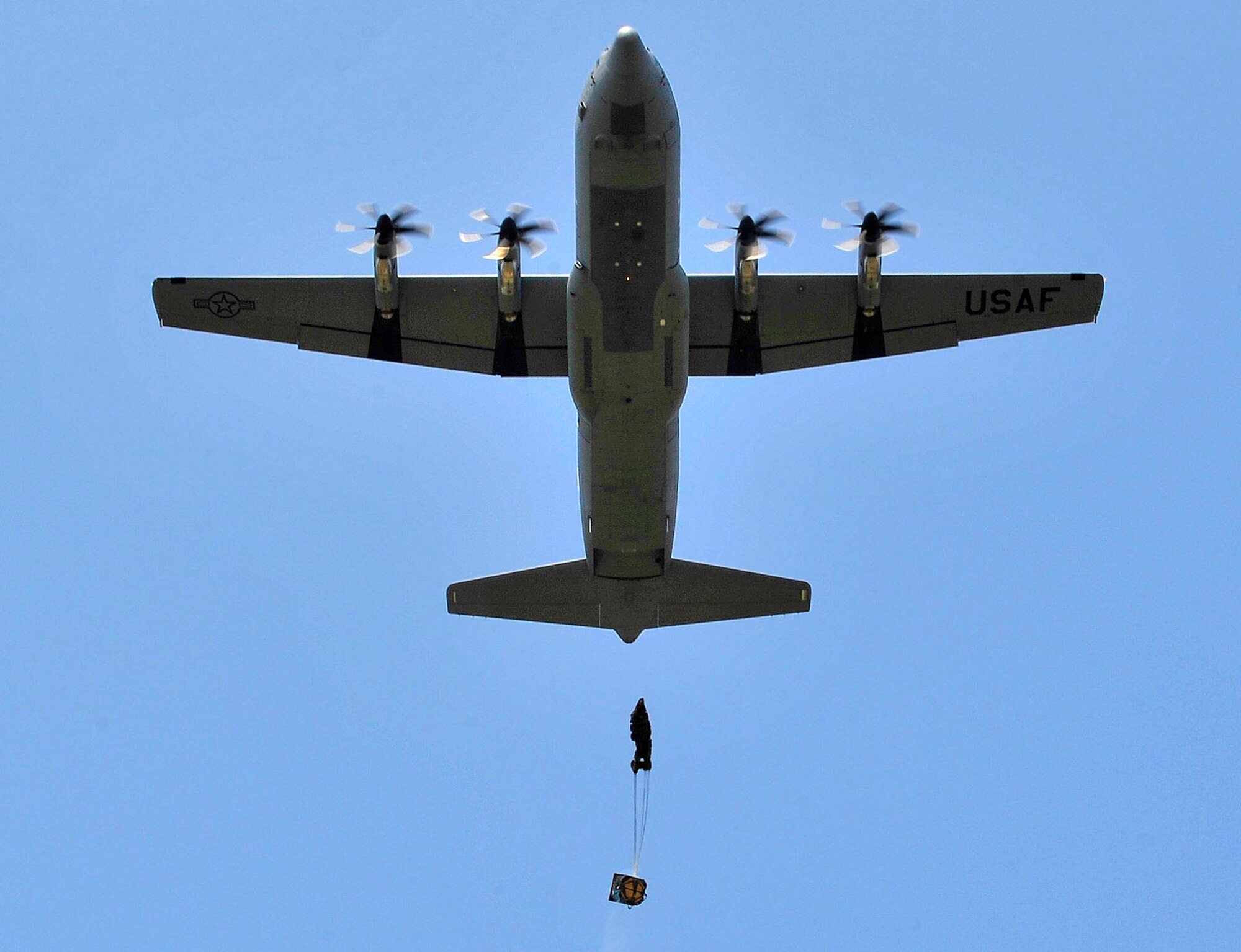 A C-130J Super Hercules drops a container deployment system during a flying training deployment, July 16th, 2013, Plovdiv, Bulgaria. FTD Thracian Summer is an opportunity for American and Bulgarian forces to train together and learn how each other perform their mission. (U.S. Air Force photo/Airman 1st Class Trevor Rhynes) 