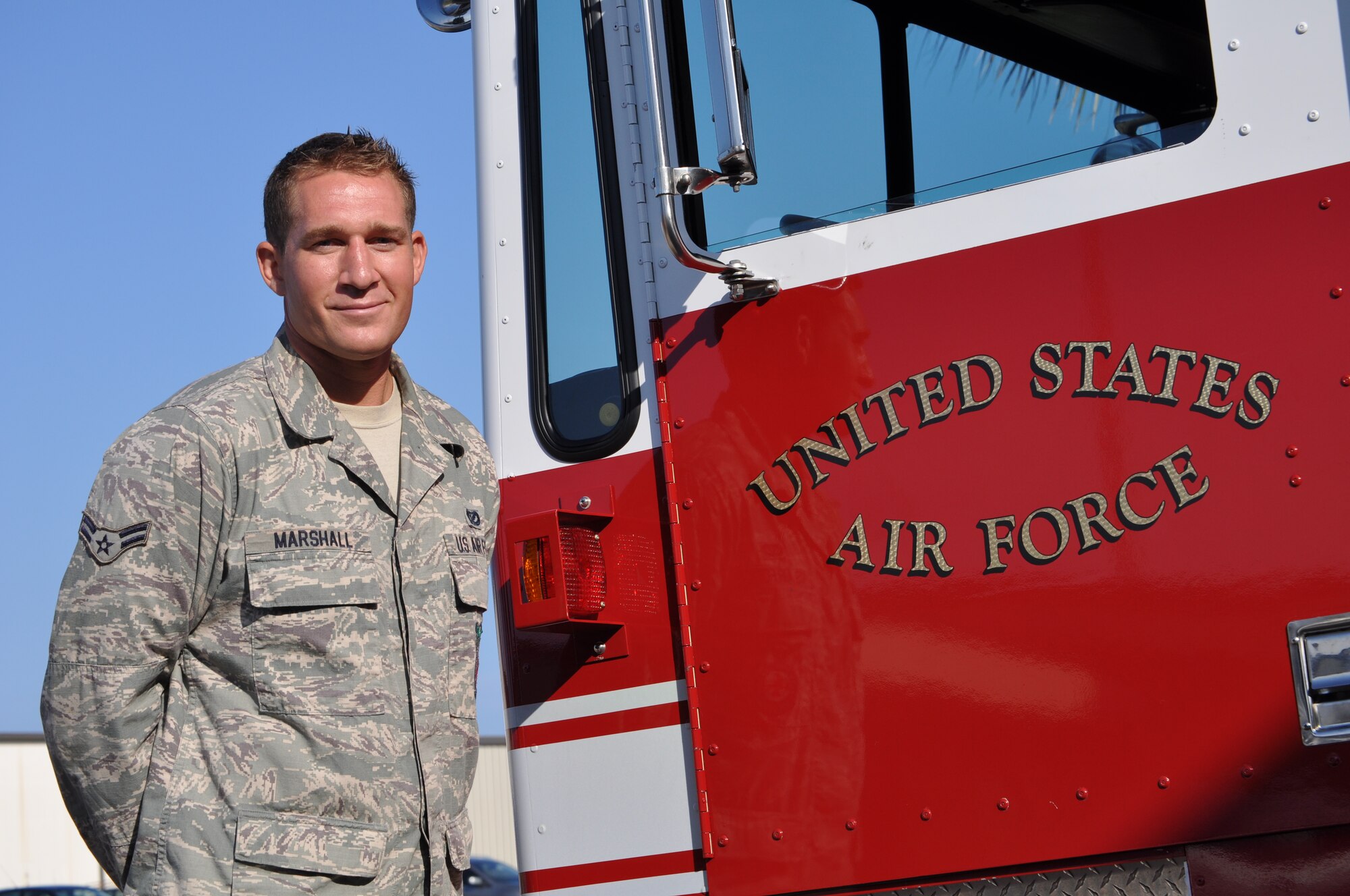 Airman 1st Class Cody Marshall, 325th Civil Engineer Squadron firefighter, spent several years playing baseball and battling back from serious injuries before deciding to trade in his baseball bat for a fire ax. (U.S. Air Force Photo by Ashley M. Wright) 
