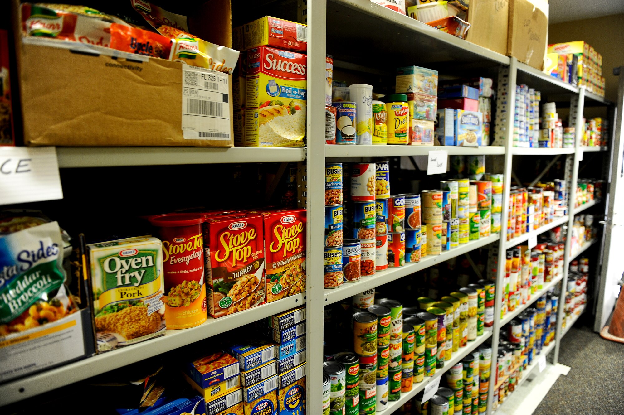 More than 3,000 pounds of non-perishable food sits on the shelves of the base food pantry located in the same building as the Airman’s Attic on Hurlburt Field, Fla., July 24, 2013. Anyone needing access to the food pantry should seek their first sergeants assistance. (U.S. Air Force photo by Airman 1st Class Jeffrey Parkinson)