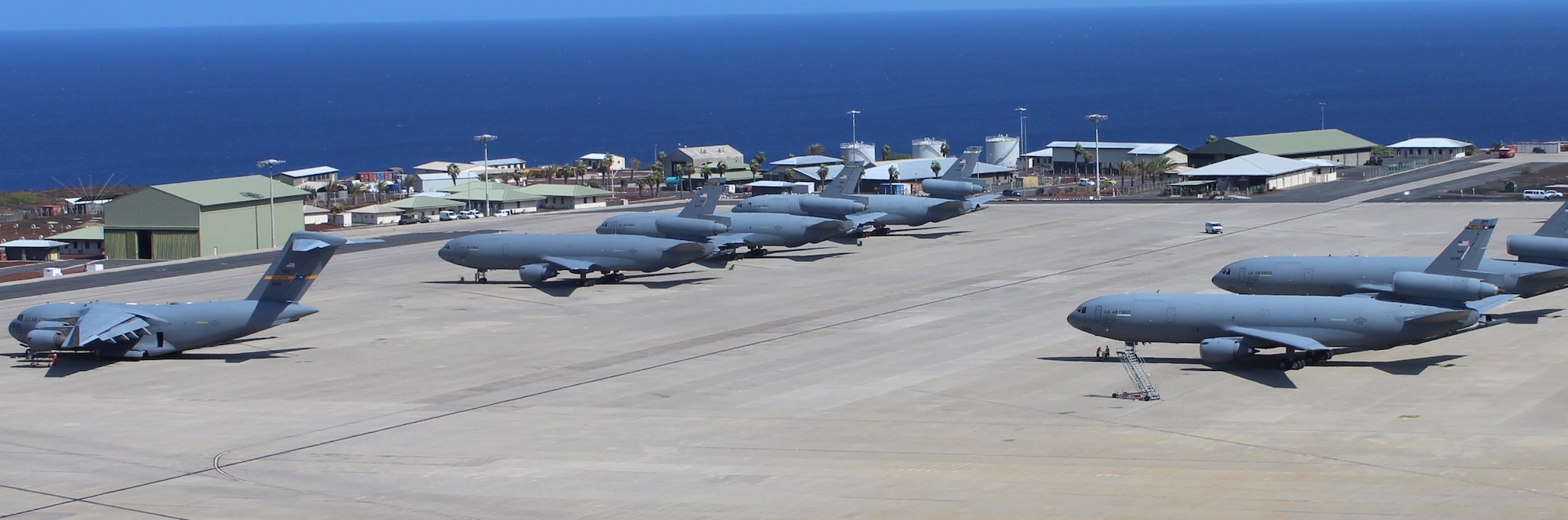 KC-10 Extenders and C-17 Globemaster III's sit on the Ascension Auxiliary Airfield Ramp at Ascension Island in the Southern Atlantic Ocean, June 28, 2013.The normally tranquil island transformed into a major military aircraft hub during the month-long operation moving equipment and passengers to and from Africa in preparation for President Barack Obama’s official state visit to the African continent. (U.S. Air Force photo by Capt. David Bredesen)