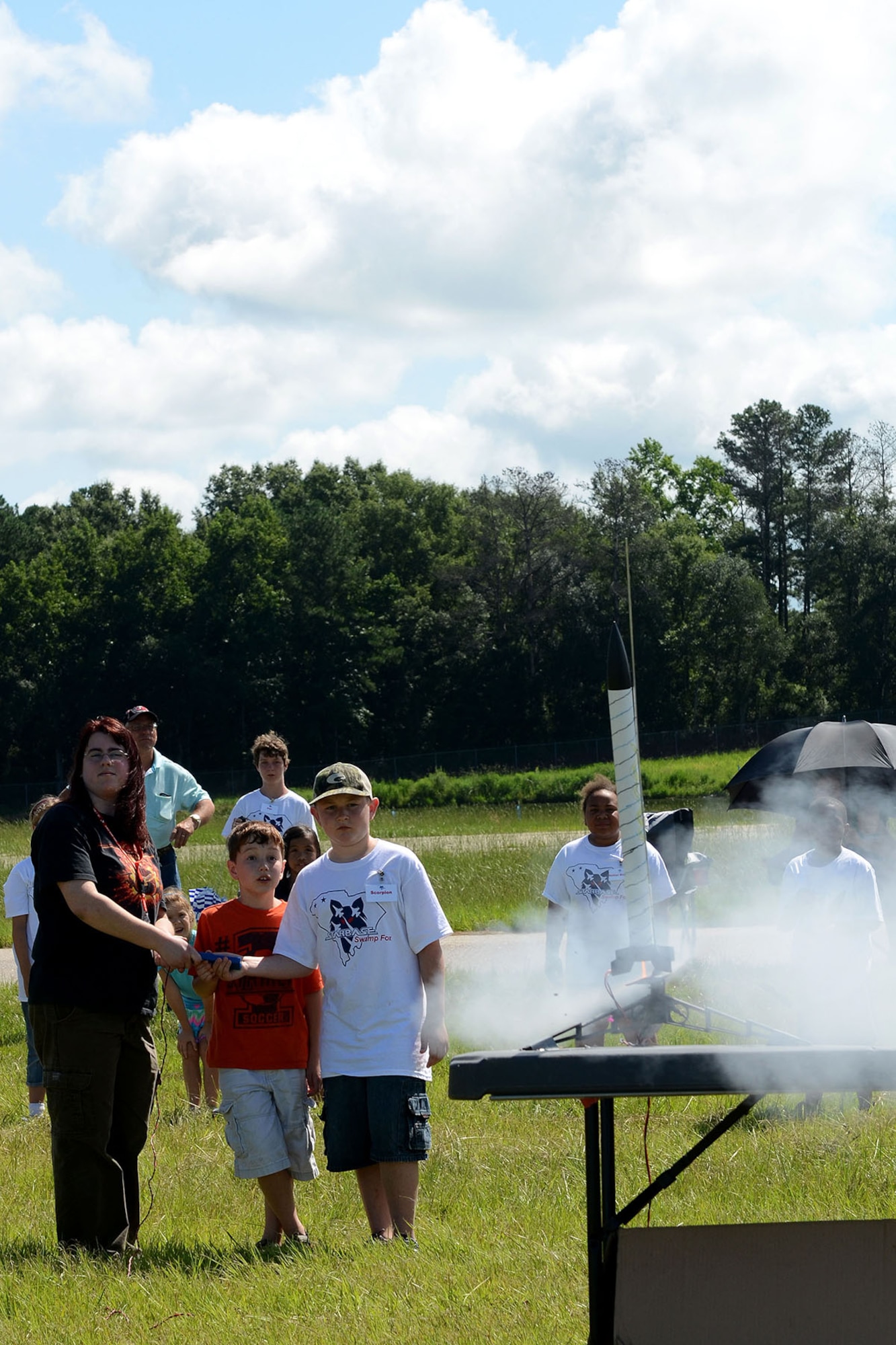 Dependents of South Carolina Army and Air National Guard Soldiers and Airmen at McEntire Joint National Guard Base attend STARBASE Swamp Fox, a DoD camp aimed at improving the knowledge and skills of youth in the areas of science, technology, engineering and mathematics, July 19, 2013. Attendees launched rockets which they studied about and built during the summer program.   (U.S. Air National Guard photo by Tech. Sgt. Caycee Watson/Released)