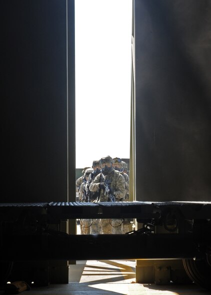 Airmen of the 39th Security Forces Squadron prepare to storm the entrance of a protected aircraft shelter during an exercise July 24, 2013, at Incirlik Air Base, Turkey. Wing-wide exercises can test any Airman’s abilities to respond to any unexpected incident. (U.S. Air Force photo by Senior Airman Chase Hedrick/Released)