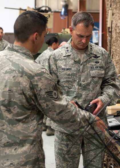 U.S. Air Force Maj. Gen. Jake Polumbo, 9th Air Force commander, looks at equipment used by the 820th Base Defense Group during a visit July 19, 2013, at Moody Air Force Base, Ga. Polumbo visited Moody for an HC-130J Combat King II arrival ceremony and to meet Airmen around base. (U.S. Air Force photo by Senior Airman Jarrod Grammel/Released) 
