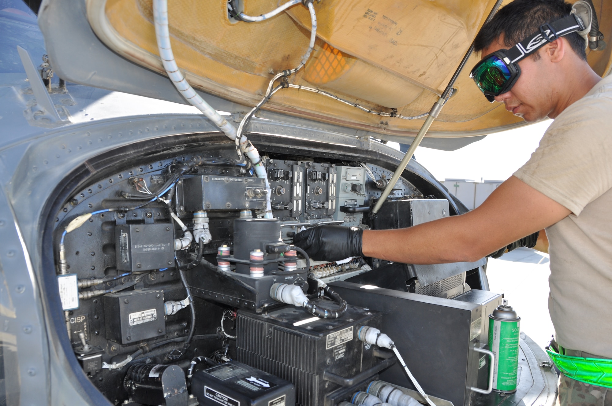 Staff Sgt. Robert Oroc, 455th Expeditionary Maintenance Squadron communications/navigation craftsmen, helps conduct a 50-hour preventative maintenance inspection on aircraft 89-6205, an HH-60G Pave Hawk helicopter assigned to the 56th Expeditionary Helicopter Maintenance Unit at Bagram Airfield, Afghanistan, July 24, 2013. The helo achieved the coveted black-letter initial exceptional release July 23, 2013, for the first time in the unit since 2005. After the ER was signed, the HH-60 launched as part of a mission attributed to saving two lives later the same day. Aircraft 89-6205 happens to be the same aircraft that attained the status for the unit eight years ago. (U.S. Air Force photo/Tech. Sgt. Rob Hazelett) 