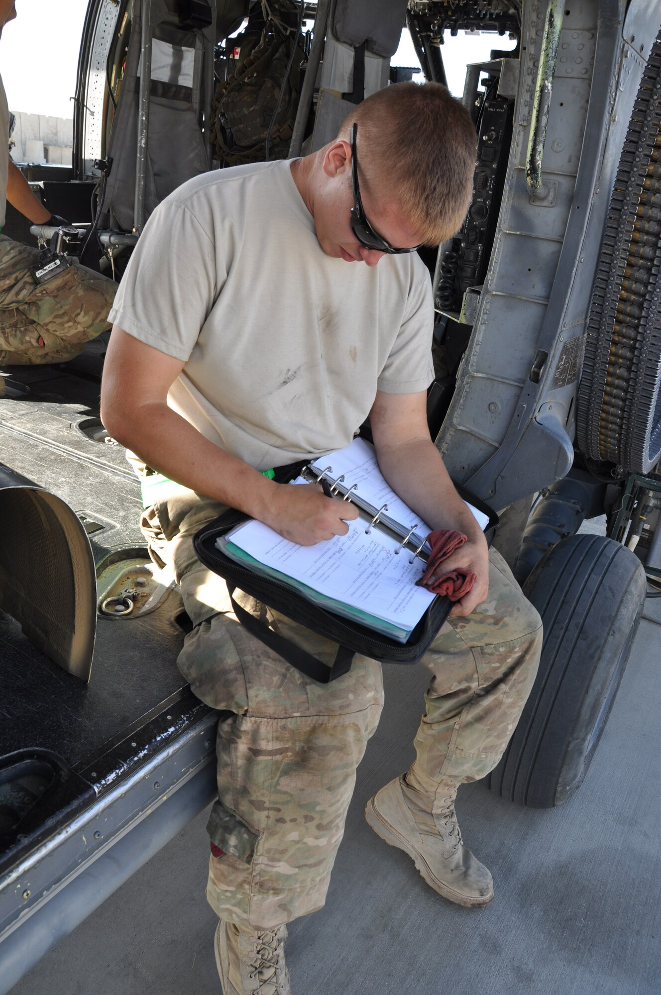 Staff Sgt. Adam Griffin, 455th Expeditionary Maintenance Squadron, helps conduct a 50-hour preventative maintenance inspection on aircraft 89-6205, an HH-60G Pave Hawk helicopter assigned to the 56th Expeditionary Helicopter Maintenance Unit at Bagram Airfield, Afghanistan, July 24, 2013. The helo achieved the coveted black-letter initial exceptional release July 23, 2013, for the first time in the unit since 2005. After the ER was signed, the HH-60 launched as part of a mission attributed to saving two lives later the same day. Aircraft 89-6205 happens to be the same aircraft that attained the status for the unit eight years ago. (U.S. Air Force photo/Tech. Sgt. Rob Hazelett) 