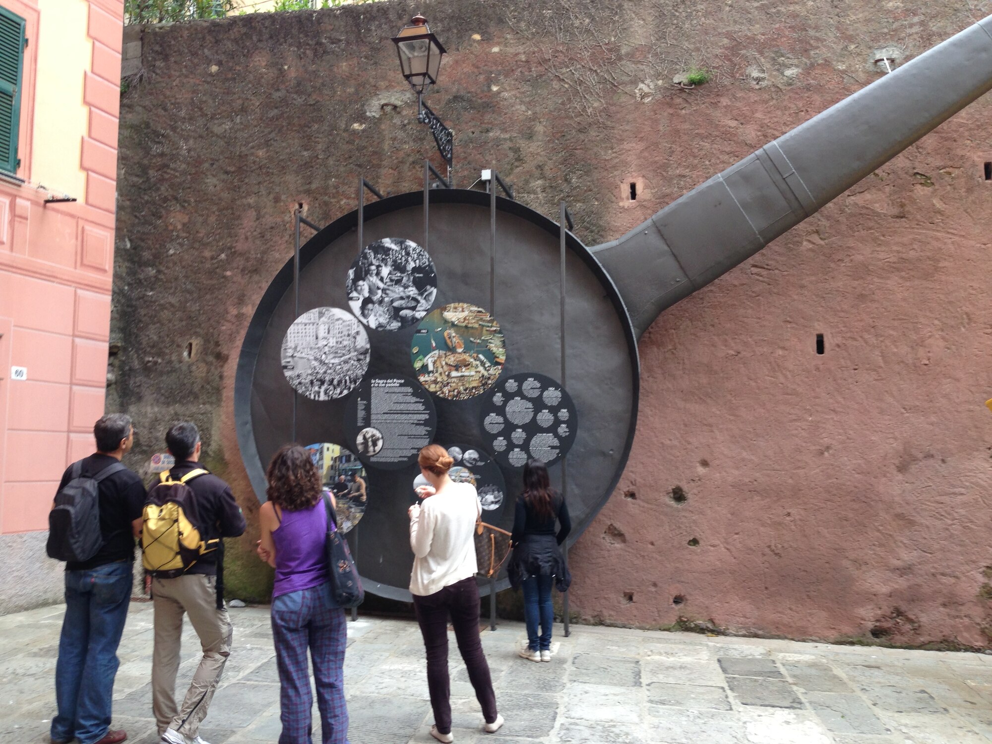 Purported by locals to be the world's largest frying pan, this 3-ton skillet is the centerpiece of Camogli's  Sagra Dei Pesce May festival, which includes a block party style fish fry. At more than 13 feet in diameter, the skillet is a local landmark that is  filled with donated fish, which is then handed out to the festival goers for free. (U.S. Air Force photo/Capt. Jose Garcia)