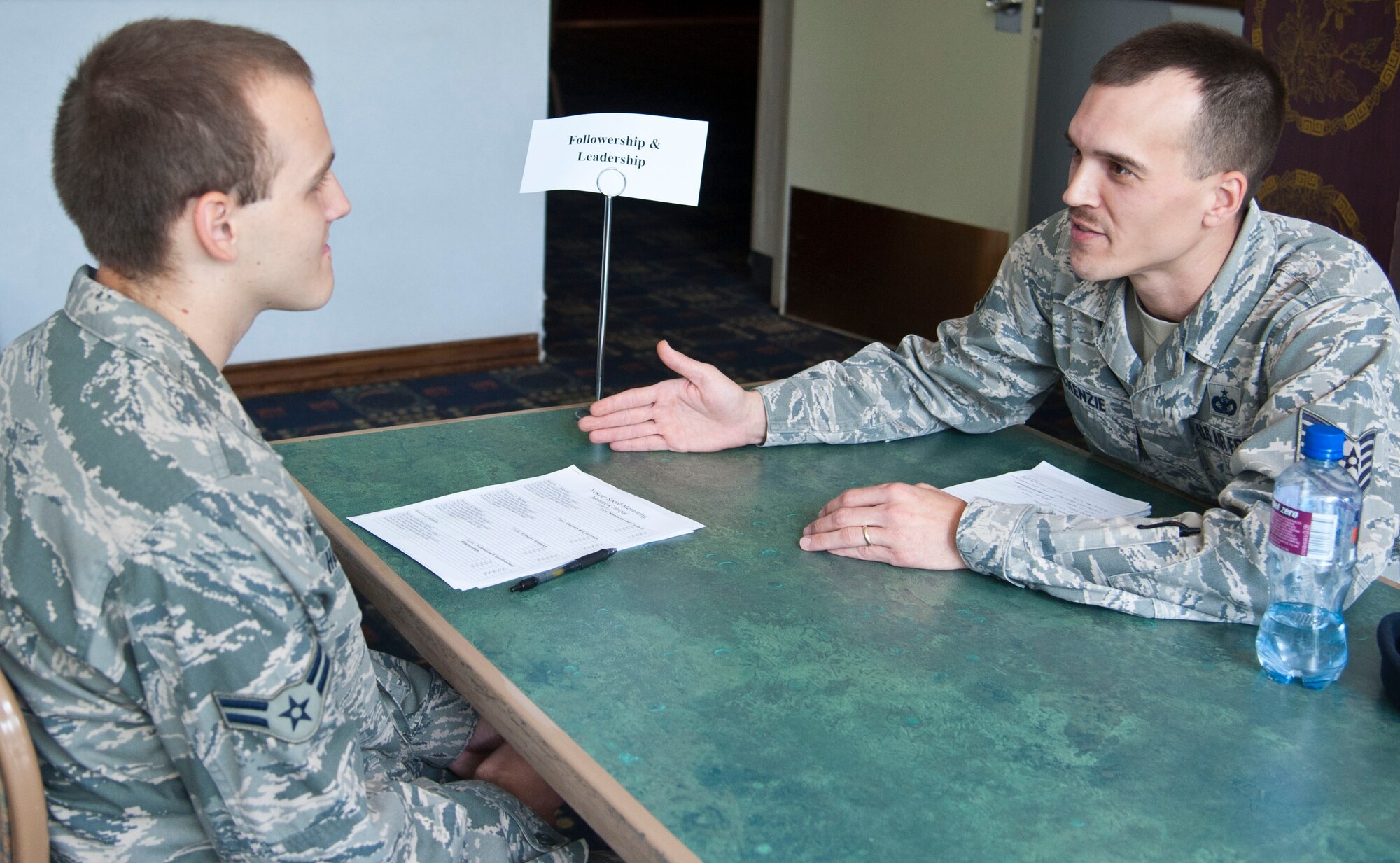 YOKOTA AIR BASE, Japan – Tech. Sgt. Shaun McKenzie, a flight chief with the 374th Security Forces Squadron, gives an Airman mentoring at Yokota Air Base, Japan, July 22, 2013.  McKenzie was one of a number of Non-commissioned officers who participated in the speed mentoring program.  (U.S. Air Force photo by Airman 1st Class Soo C. Kim)