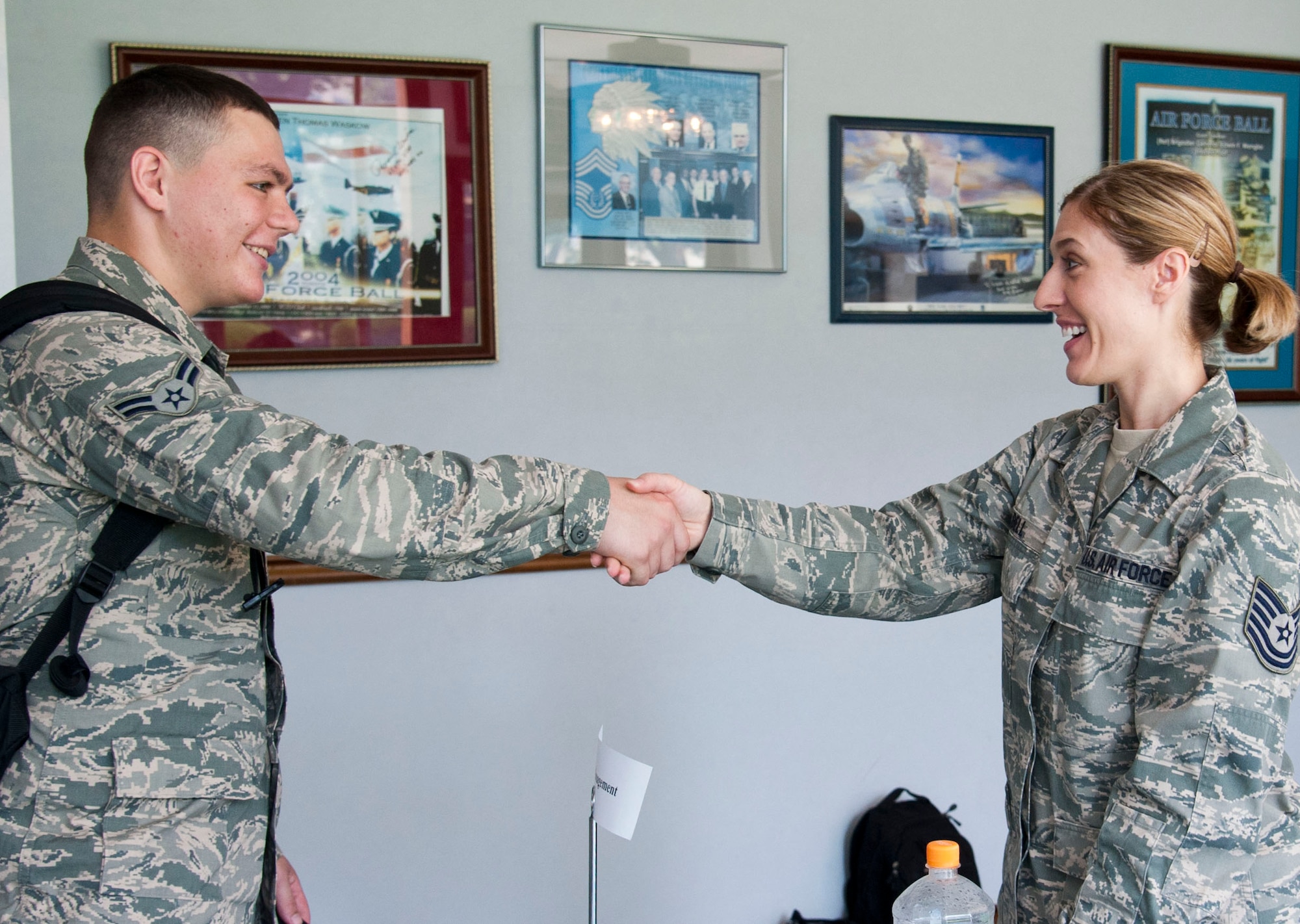 YOKOTA AIR BASE, Japan – Airman 1st Class Lucas Givens, a patrolman with the 374th Security Forces Squadron, and Tech. Sgt. Jessica Bell, a man power analyst with the 374th Force Support Squadron, greet each other before their speed mentor session at Yokota Air Base, Japan, July 22, 2013.  “(From today’s mentoring,) I hope the Airmen get one or two tips to improve their career,” said Bell.  (U.S. Air Force photo by Airman 1st Class Soo C. Kim)