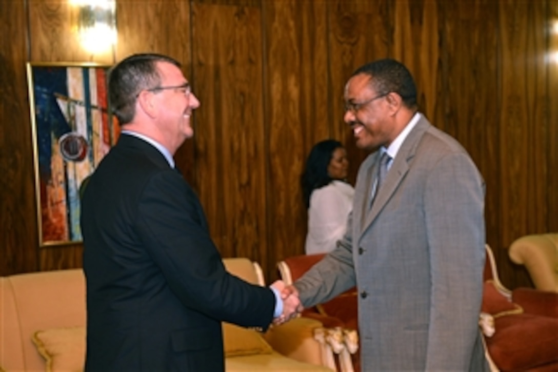 Deputy Secretary of Defense Ashton B. Carter, left, is greeted by Ethiopian Prime Minister Hailemariam Desalegn at his office in Addis Ababa, Ethiopia, on July 24, 2013.  Carter is visiting Ethiopia to meet with senior government and military leaders to affirm the growing security partnership between the United States and the East African nation.  