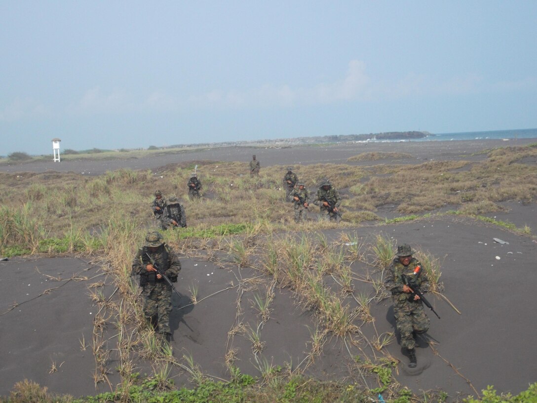 Members of Guatemala’s Fuerzas Especiales Naval walk along Guatemala’s western coastline during a security-patrol exercise administered by Marines from U.S. Marine Corps Forces South’s Security Cooperation Team.  The Security Cooperation Team trained members of the FEN in a variety of military classes, including human rights, first aid, small-unit leadership, and weapon-systems marksmanship. (Official Marine Corps photo: Courtesy//Released)