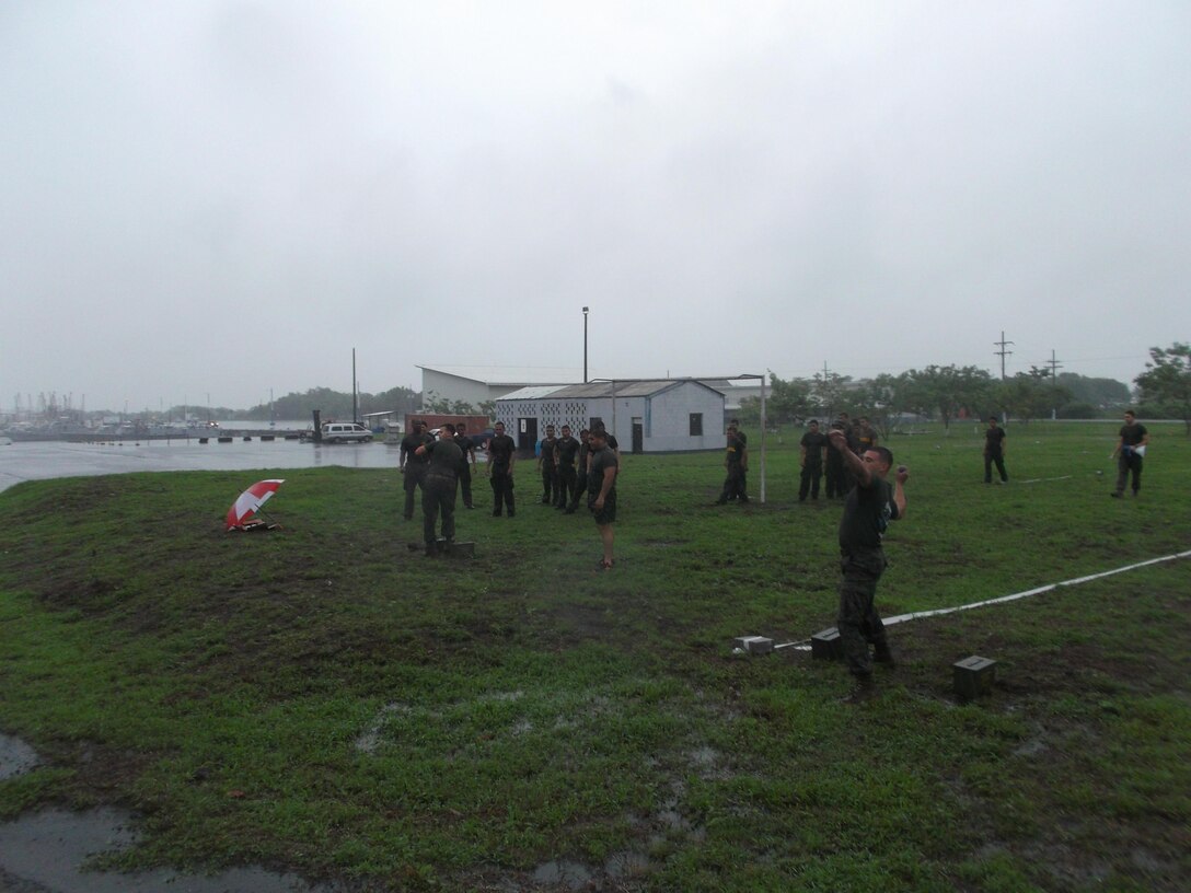 U.S. Marine Corps Sgt. Joshua Sanchez and Lance Cpl. Jonathan Guilbeau, both members of U.S. Marine Corps Forces South’s Security Cooperation Team, demonstrate  different elements of the Combat Fitness Test for Guatemala’s Fuerzas Especiales Naval. The Security Cooperation Team trained members of the FEN in a variety of military classes, including human rights, first aid, small-unit leadership, and weapon-systems marksmanship. (Official Marine Corps photo: Courtesy//Released)
