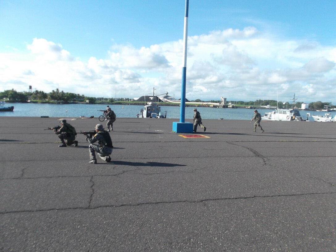 Members of Guatemala’s Fuerzas Especiales Naval rehearse immediate-action drills during security-patrol training administered by U.S. Marine Corps Forces South’s Security Cooperation Team.  The Security Cooperation Team trained members of the FEN in a variety of military classes , including human rights, first aid, small-unit leadership, and weapon-systems marksmanship. (Official Marine Corps photo: Courtesy//Released)