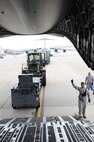 Joint Base McGuire-Dix-Lakehurst airmen load and secure equipment onto aircraft in preparation of Hurricane Irene Aug. 26, 2011. All JB MDL aircraft are being evacuated to Air Force Base's around the country.